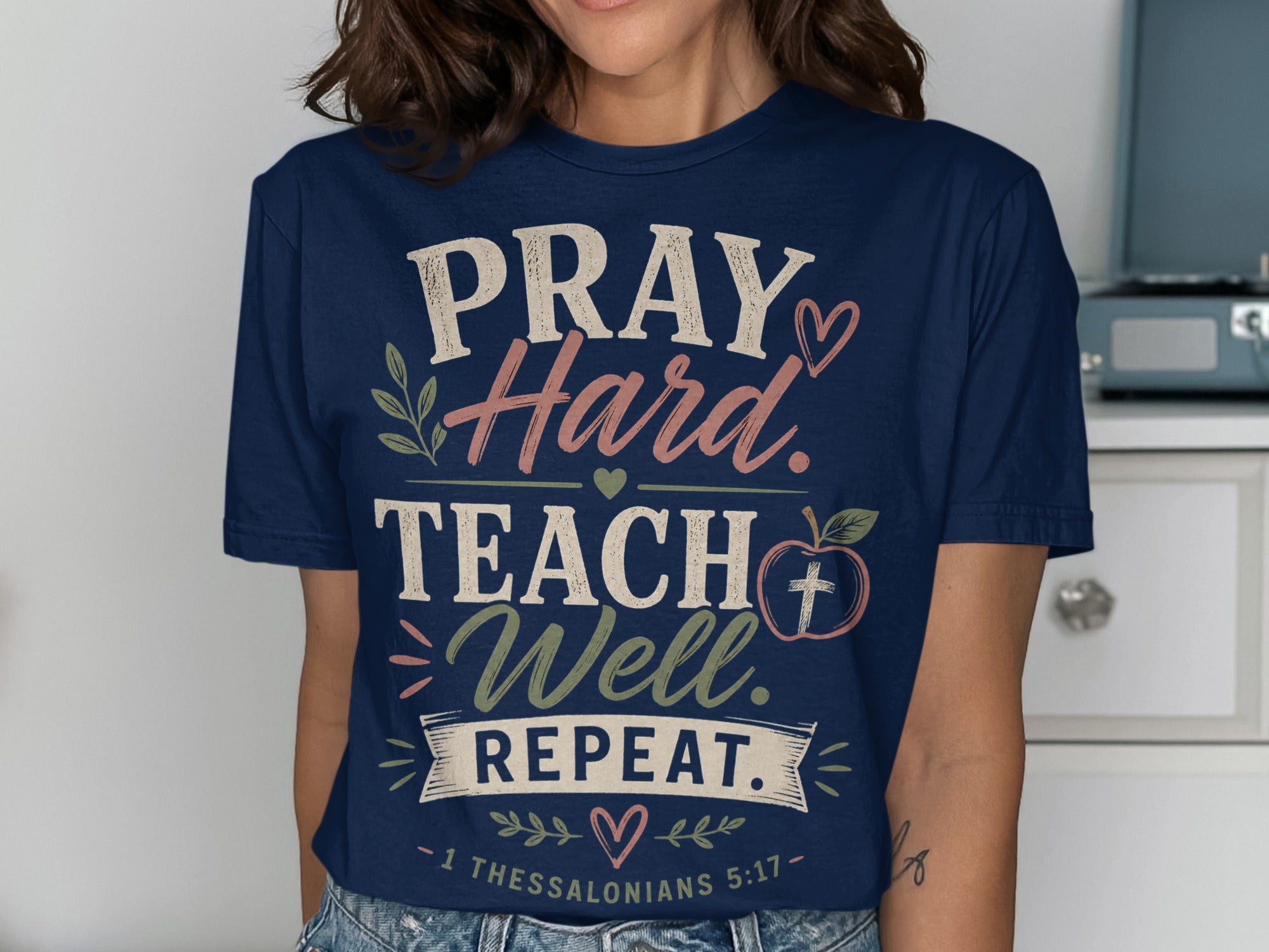 Navy t-shirt with "Pray Hard. Teach Well. Repeat." and Bible verse.