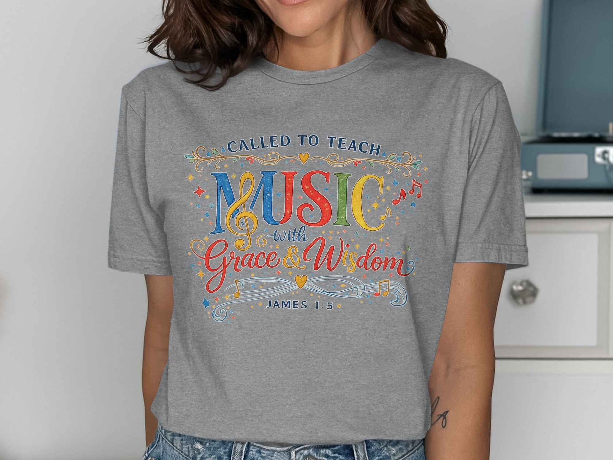 Grey t-shirt with "CALLED TO TEACH MUSIC with Grace & Wisdom" and "JAMES 1:5".