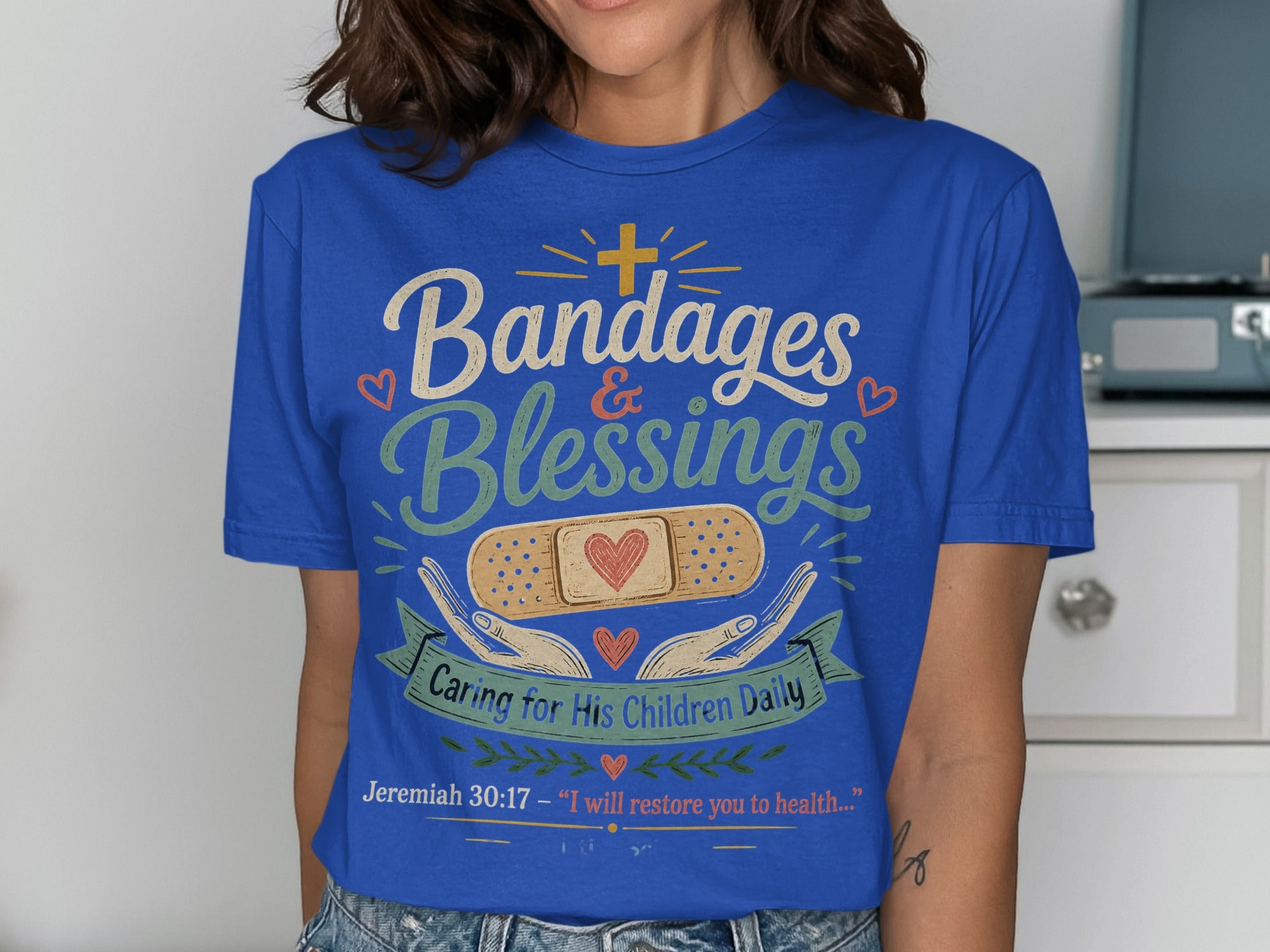 Blue t-shirt with "Bandages & Blessings" and Jeremiah 30:17 quote.