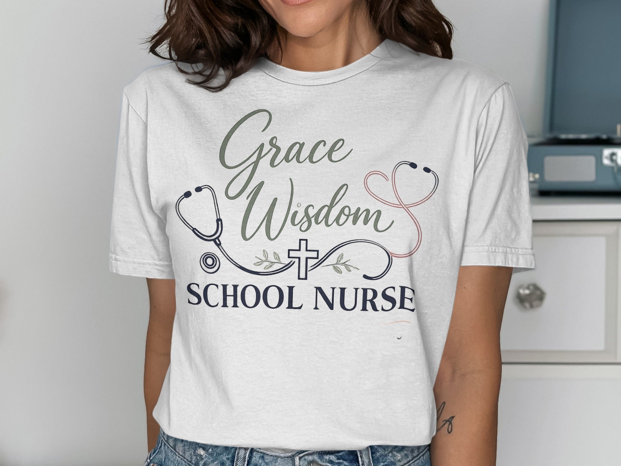 White t-shirt with "Grace Wisdom School Nurse" and stethoscope graphics.