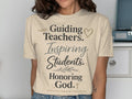 T-shirt with text "Guiding Teachers. Inspiring Students. Honoring God."