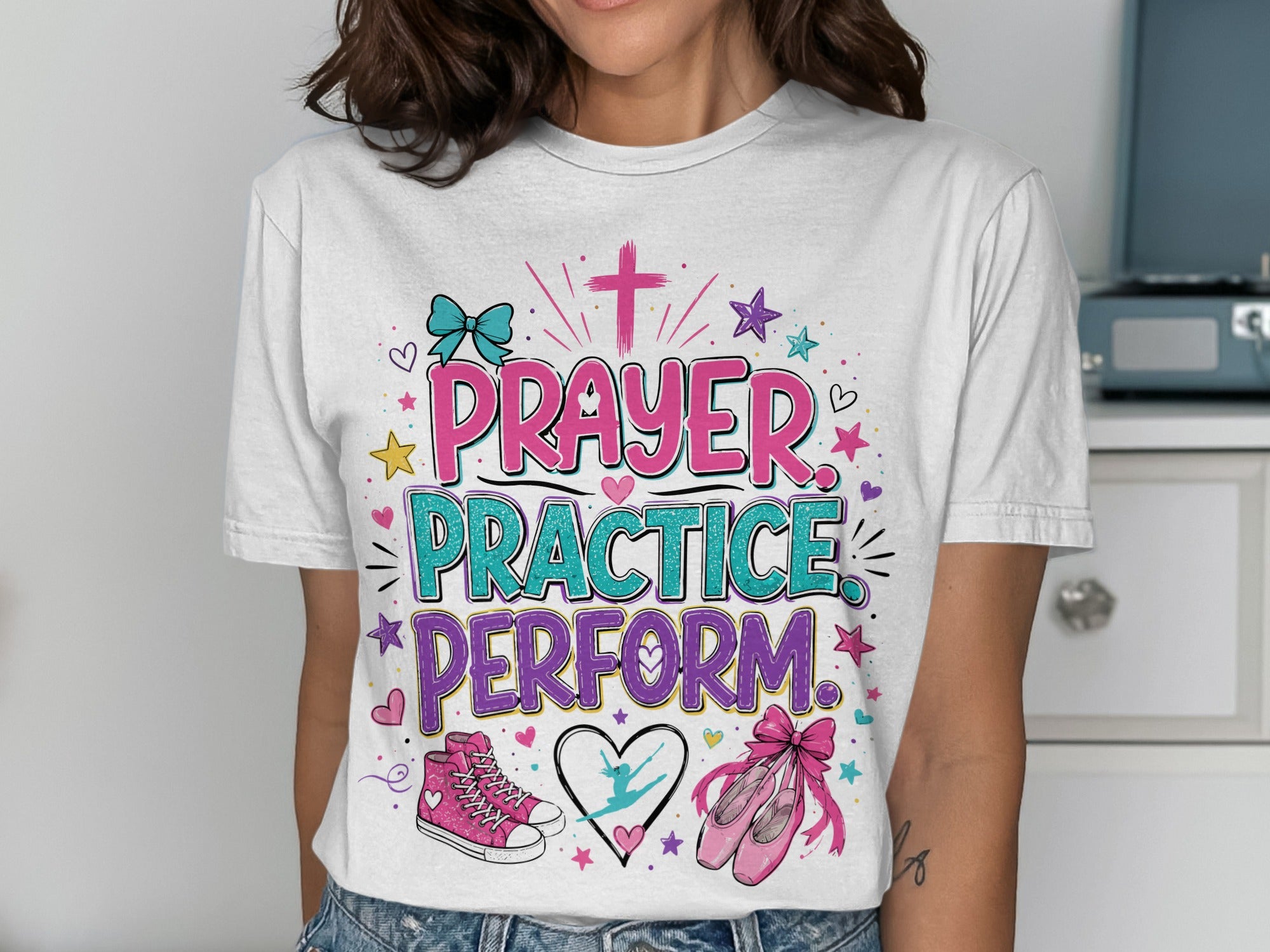 White t-shirt with "Prayer Practice Perform" text, ballet shoes, and hearts.