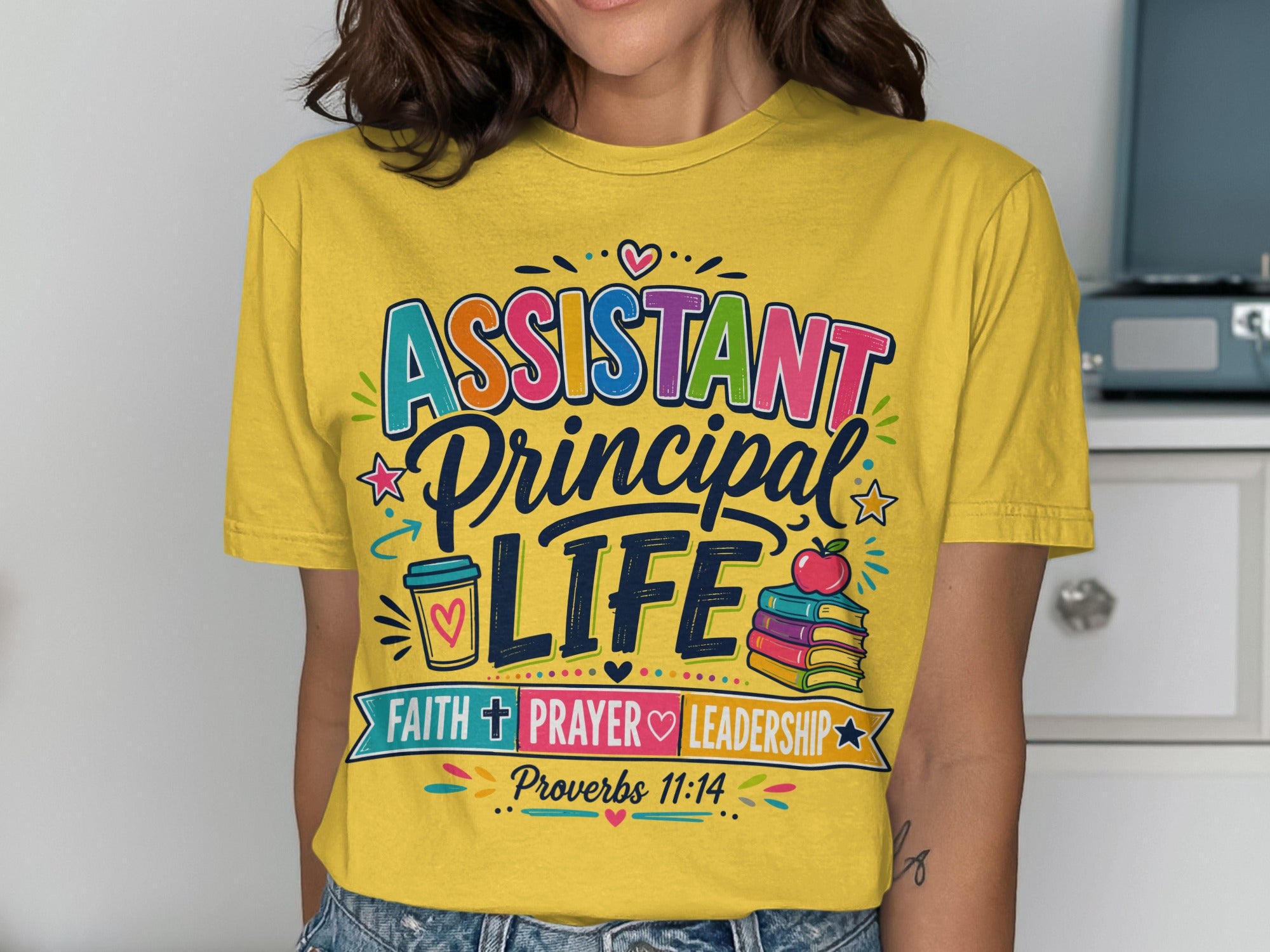 Yellow t-shirt with "ASSISTANT PRINCIPAL LIFE" text and Proverbs 11:14.