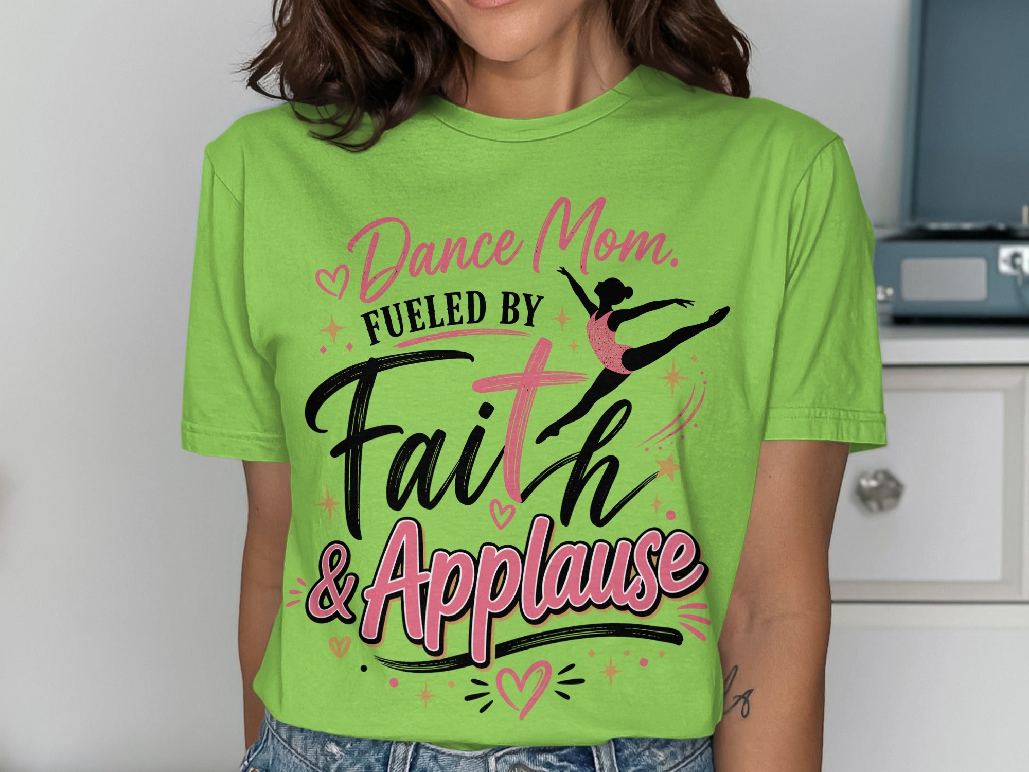 Green t-shirt with "Dance Mom. Fueled by Faith & Applause" text and ballerina graphic.