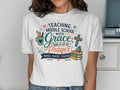 T-shirt with "Teaching Middle School with Grace and a Lot of Prayer" text.