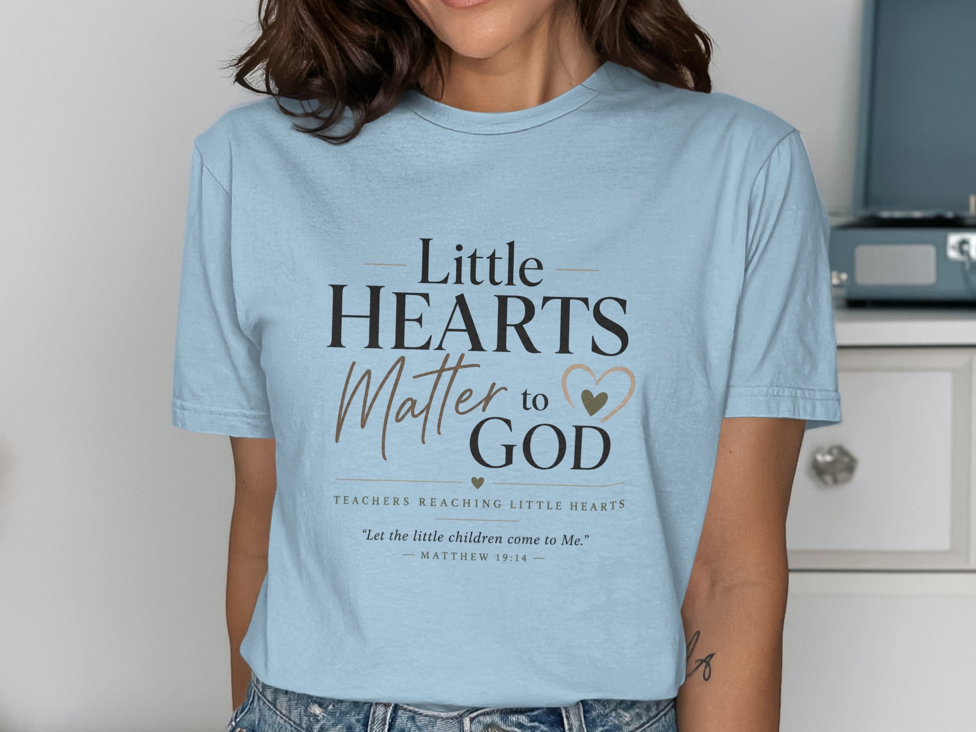 Light blue t-shirt with "Little HEARTS Matter to GOD" and Bible verse.