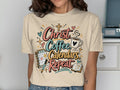 Christ coffee calendars repeat text on a t-shirt with icons.
