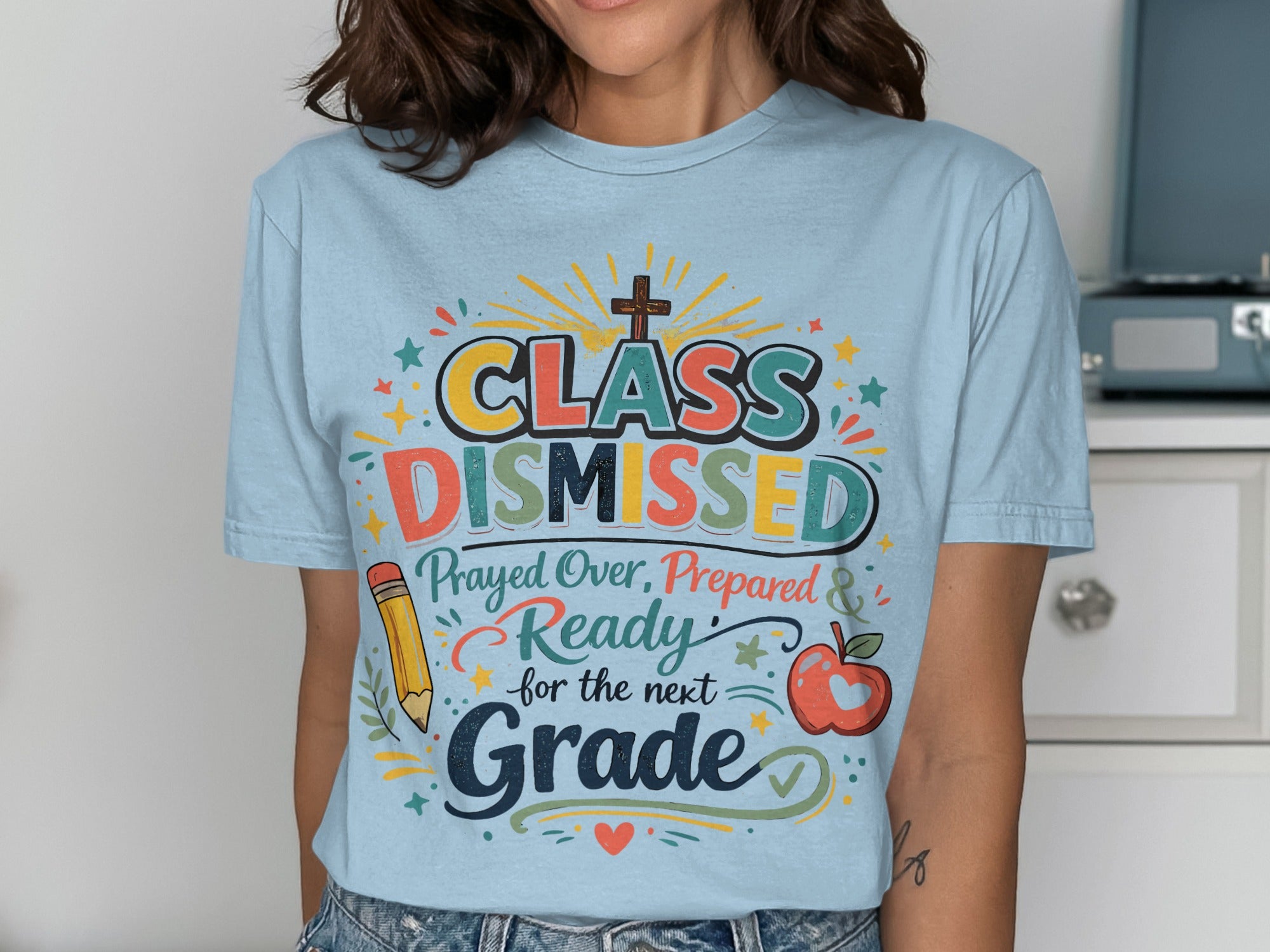 Light blue t-shirt with "CLASS DISMISSED" and school-themed graphics.
