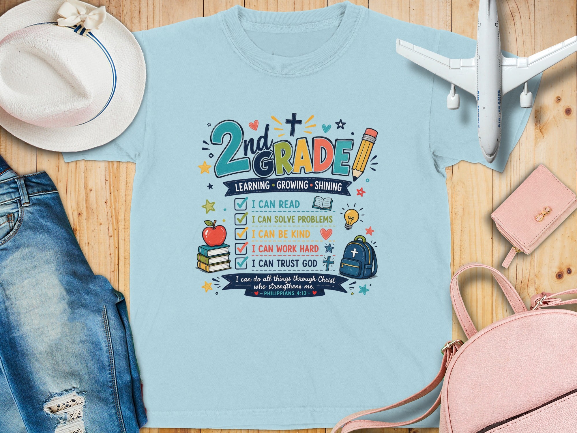 Light blue t-shirt with "2nd GRADE" and Bible verse about learning and faith.