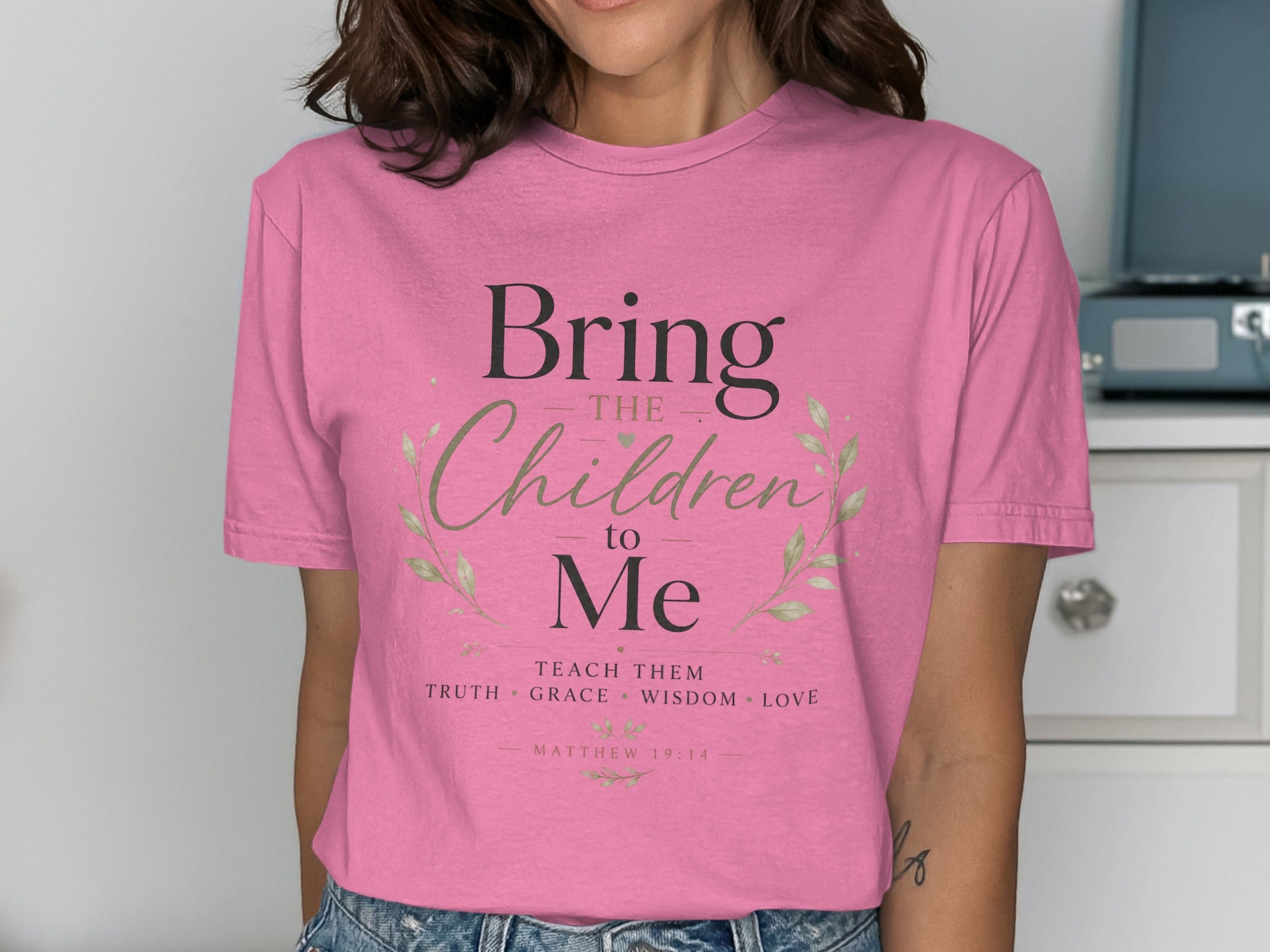 Pink t-shirt with "Bring the Children to Me" and scripture.