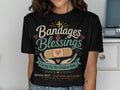 Black t-shirt with "Bandages & Blessings" and Jeremiah 30:17 Bible quote.