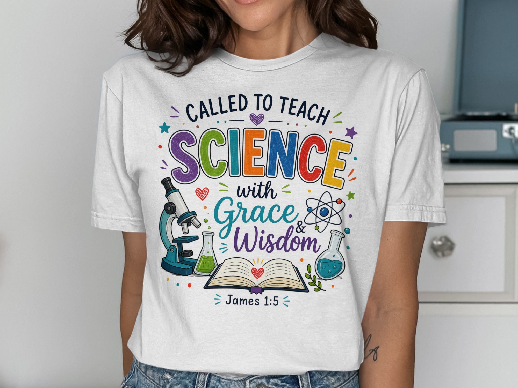 White t-shirt with "Called to Teach Science with Grace & Wisdom" and science icons.