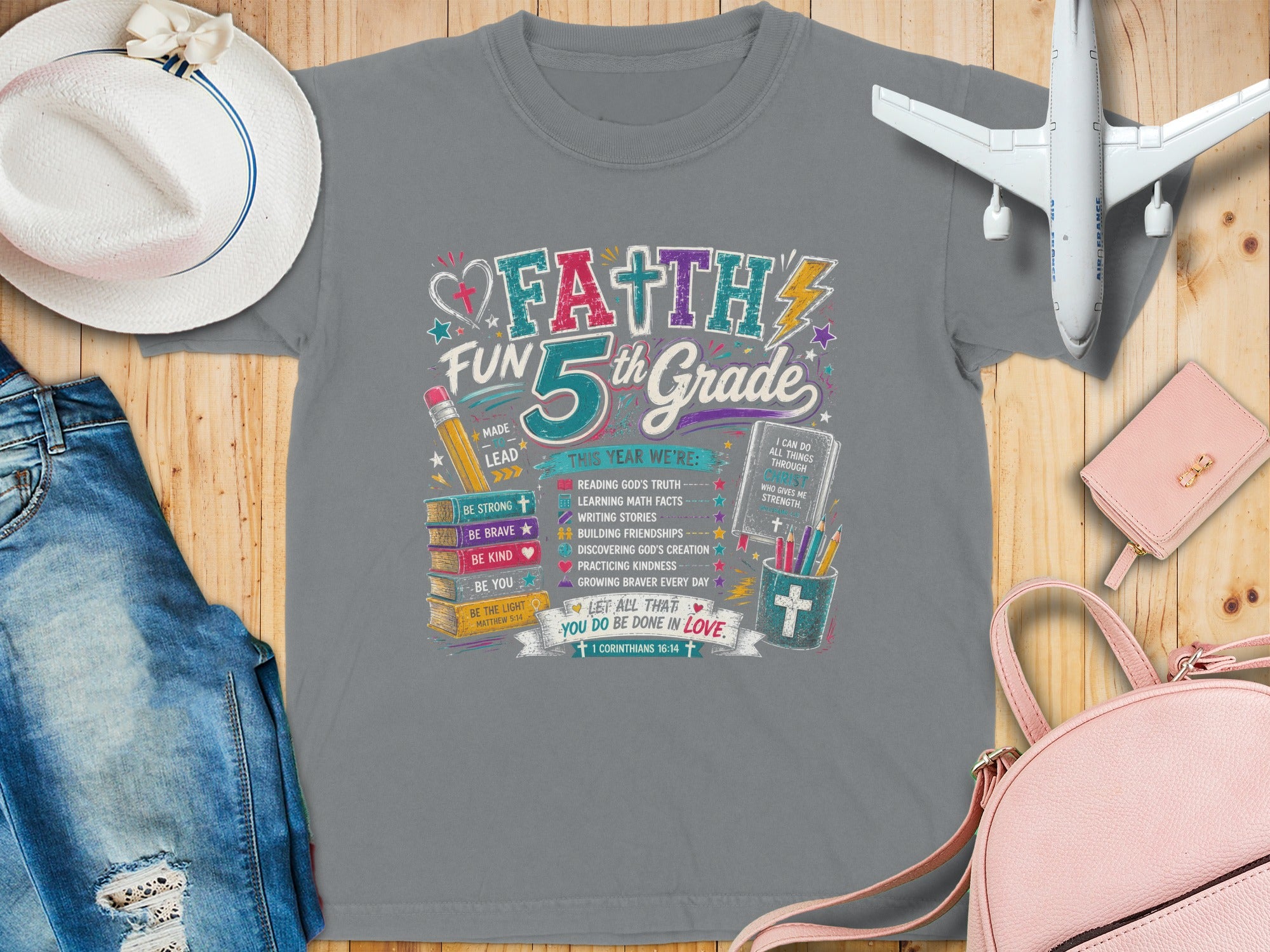 Faith 5th Grade graphic tee with school and Bible verses, including "Faith" and "I can do all things".