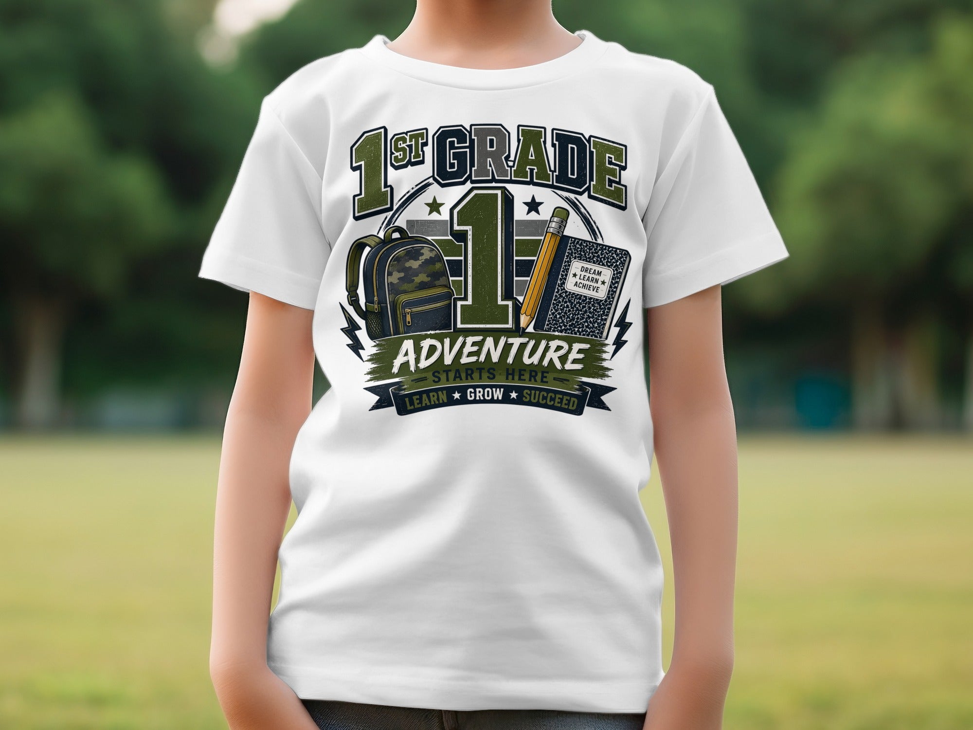 1st grade t-shirt with backpack, pencil, and "Dream, Learn, Achieve" text.