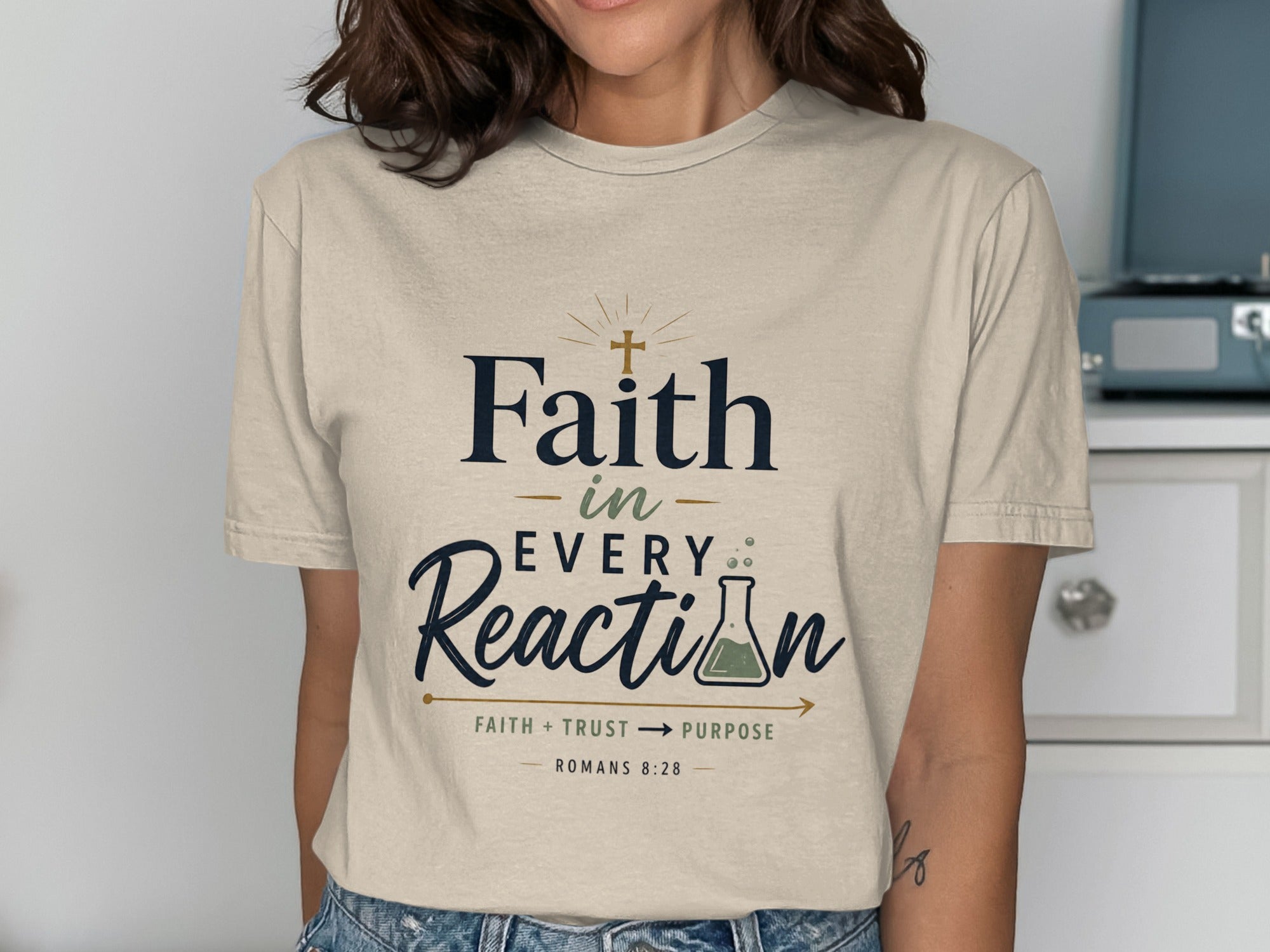 Faith in Every Reaction t-shirt with cross and beaker graphic.