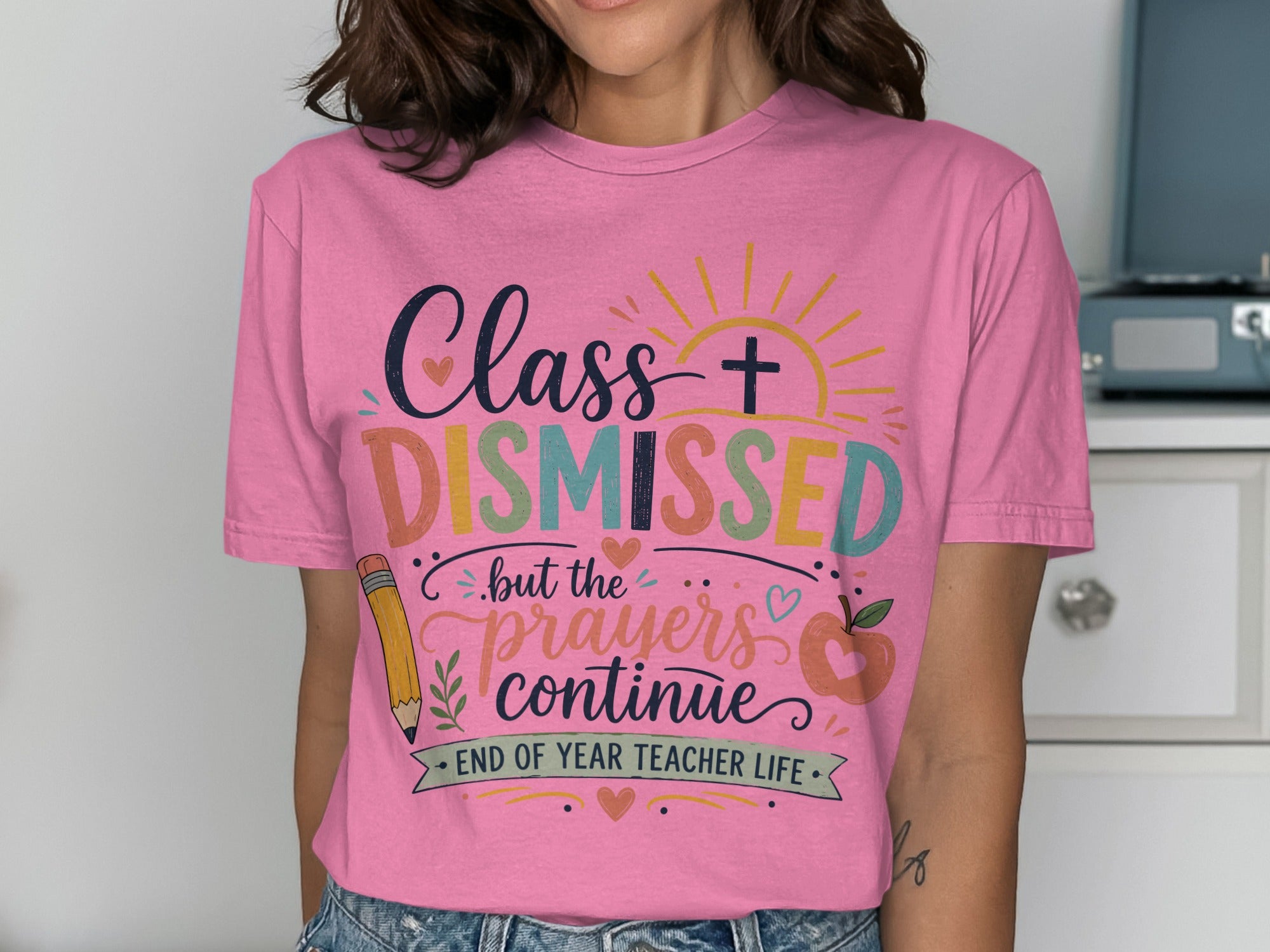 Pink t-shirt with "Class DISMISSED but the prayers continue" text.