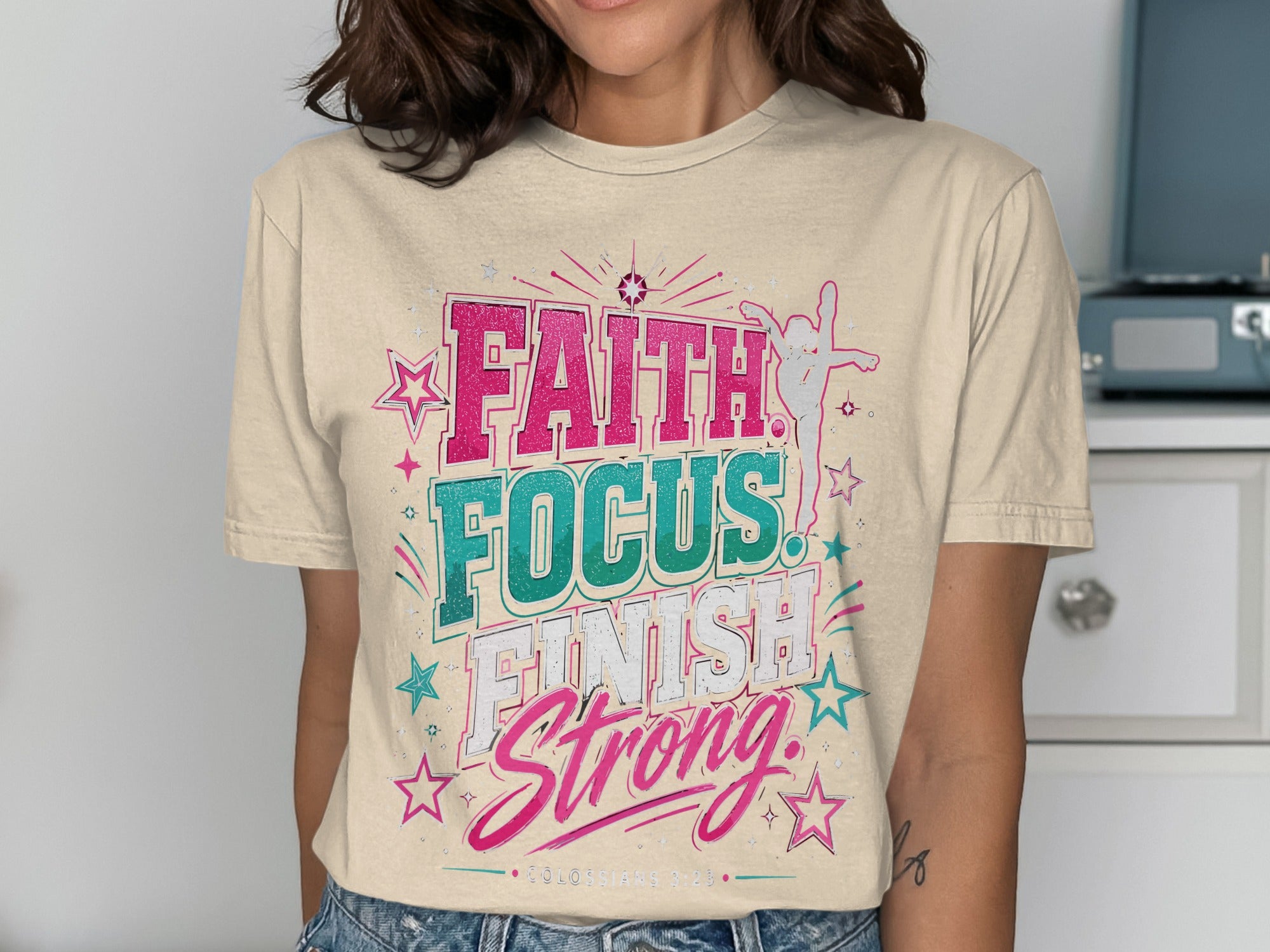 Faith Focus Finish Strong t-shirt with stars and decorative elements.