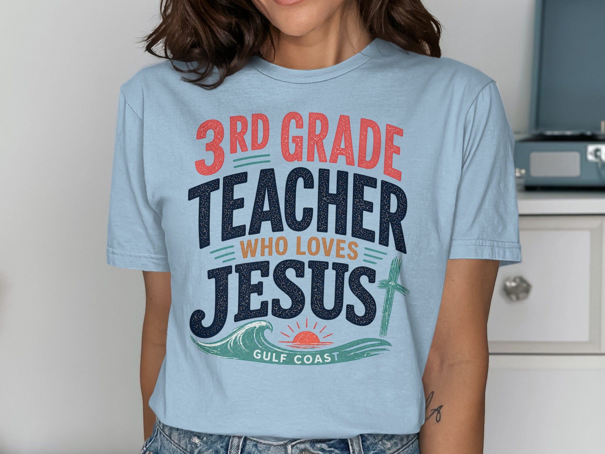 Light blue t-shirt with "3rd Grade Teacher Who Loves Jesus" and "Gulf Coast" text.