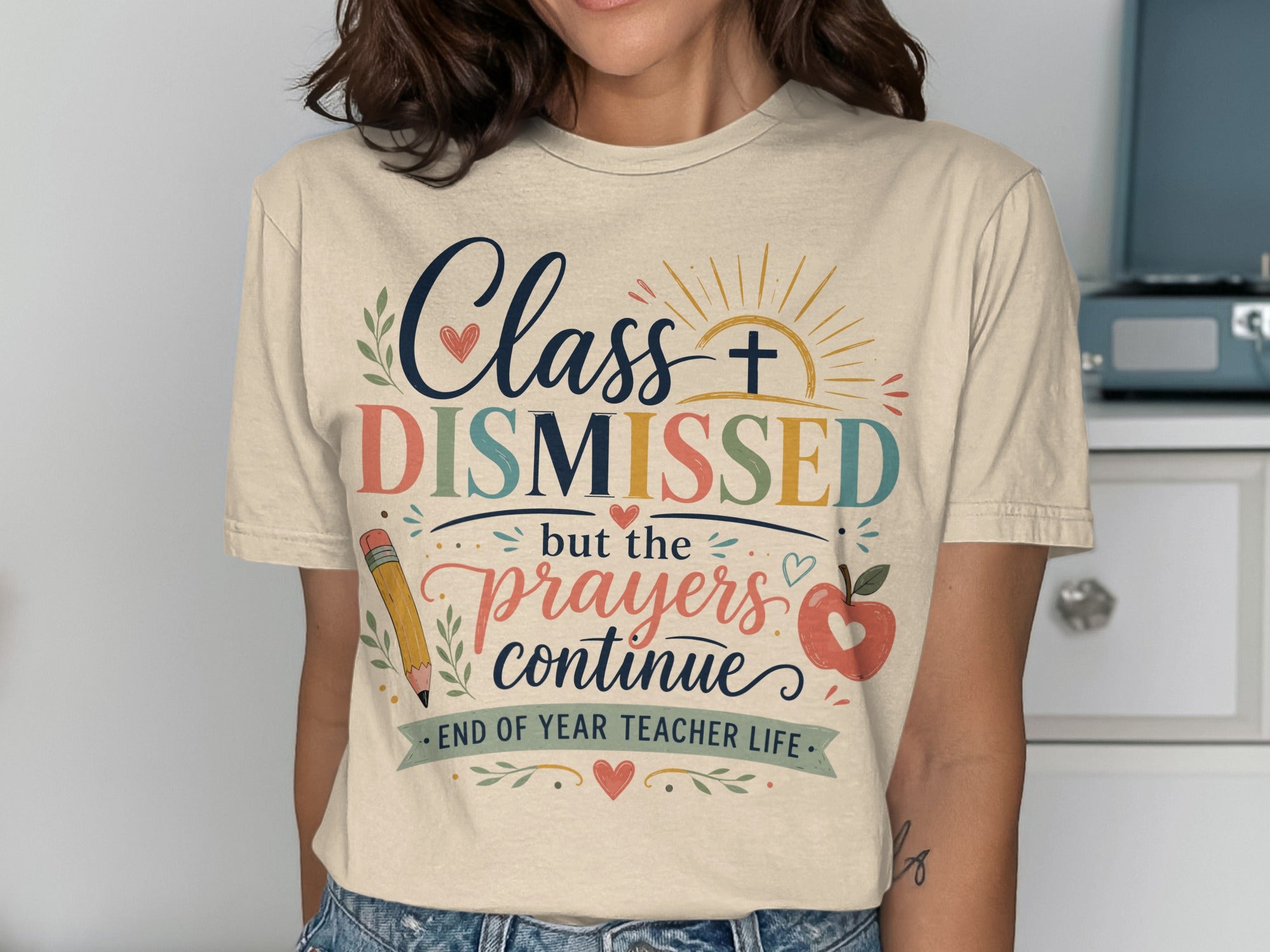 T-shirt with "Class DISMISSED but the prayers continue" and teacher icons.