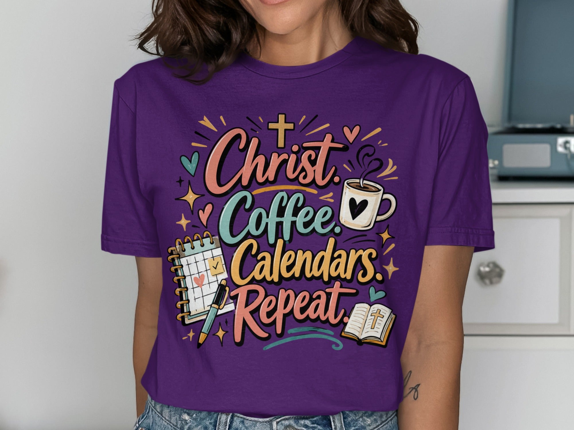 T-shirt with "Christ Coffee Calendars. Repeat." text and religious motifs.