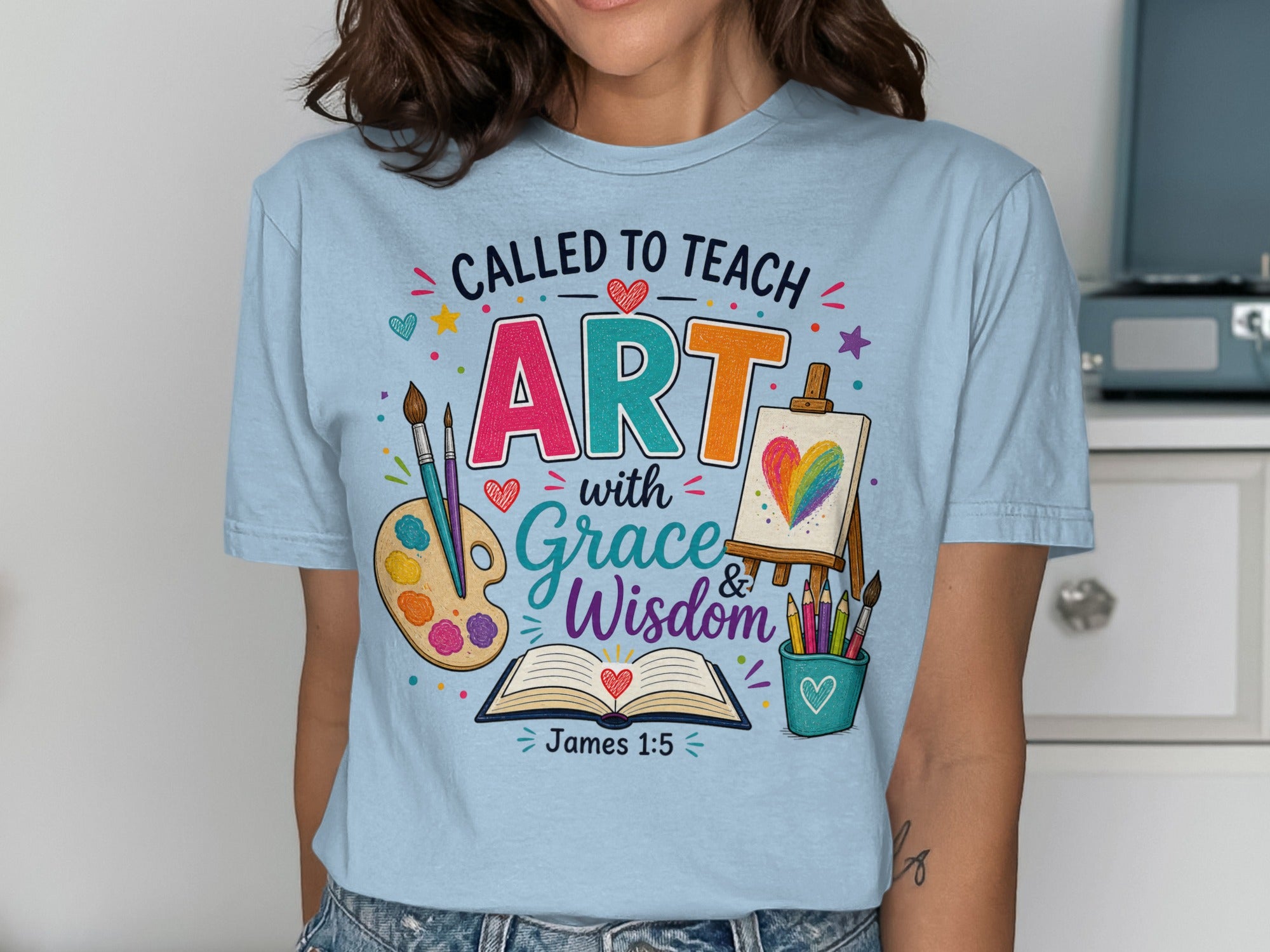 T-shirt with "Called to Teach ART with Grace & Wisdom" and Bible verse James 1:5.