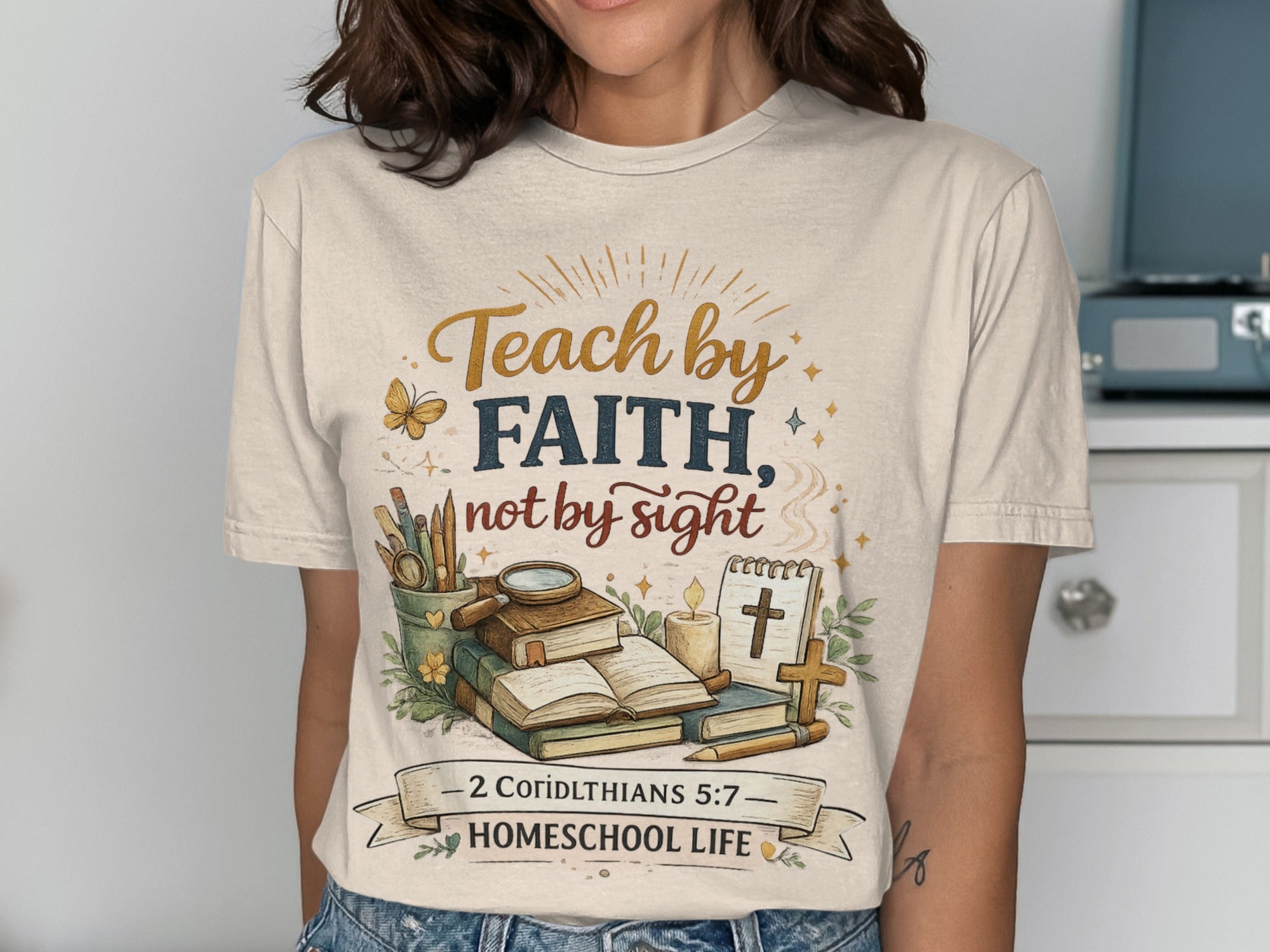 Cream t-shirt with "Teach by Faith, not by sight" and "2 Corinthians 5:7 Homeschool Life" text.