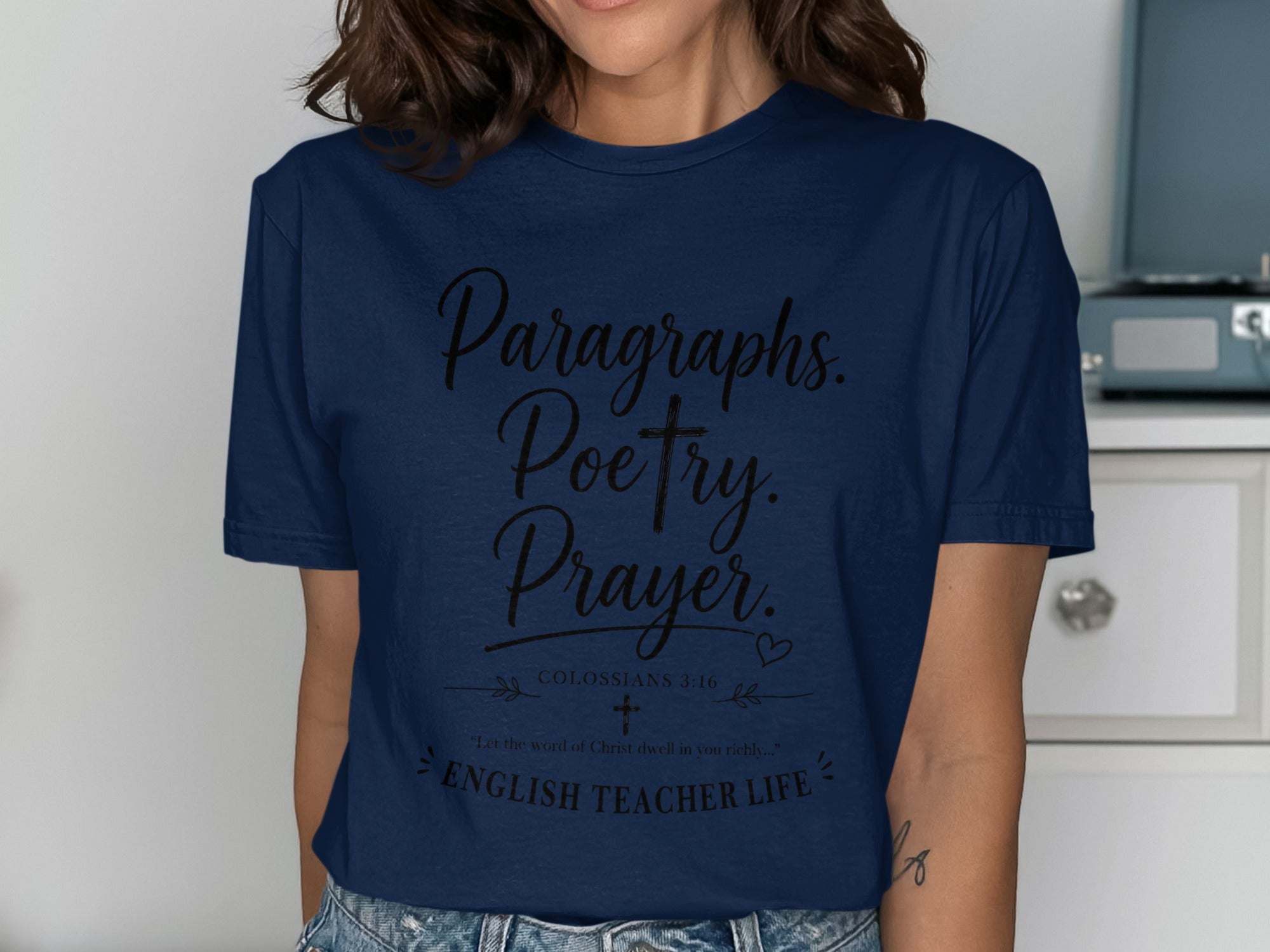 Navy t-shirt with "Paragraphs. Poetry. Prayer. Colossians 3:16. English Teacher Life."