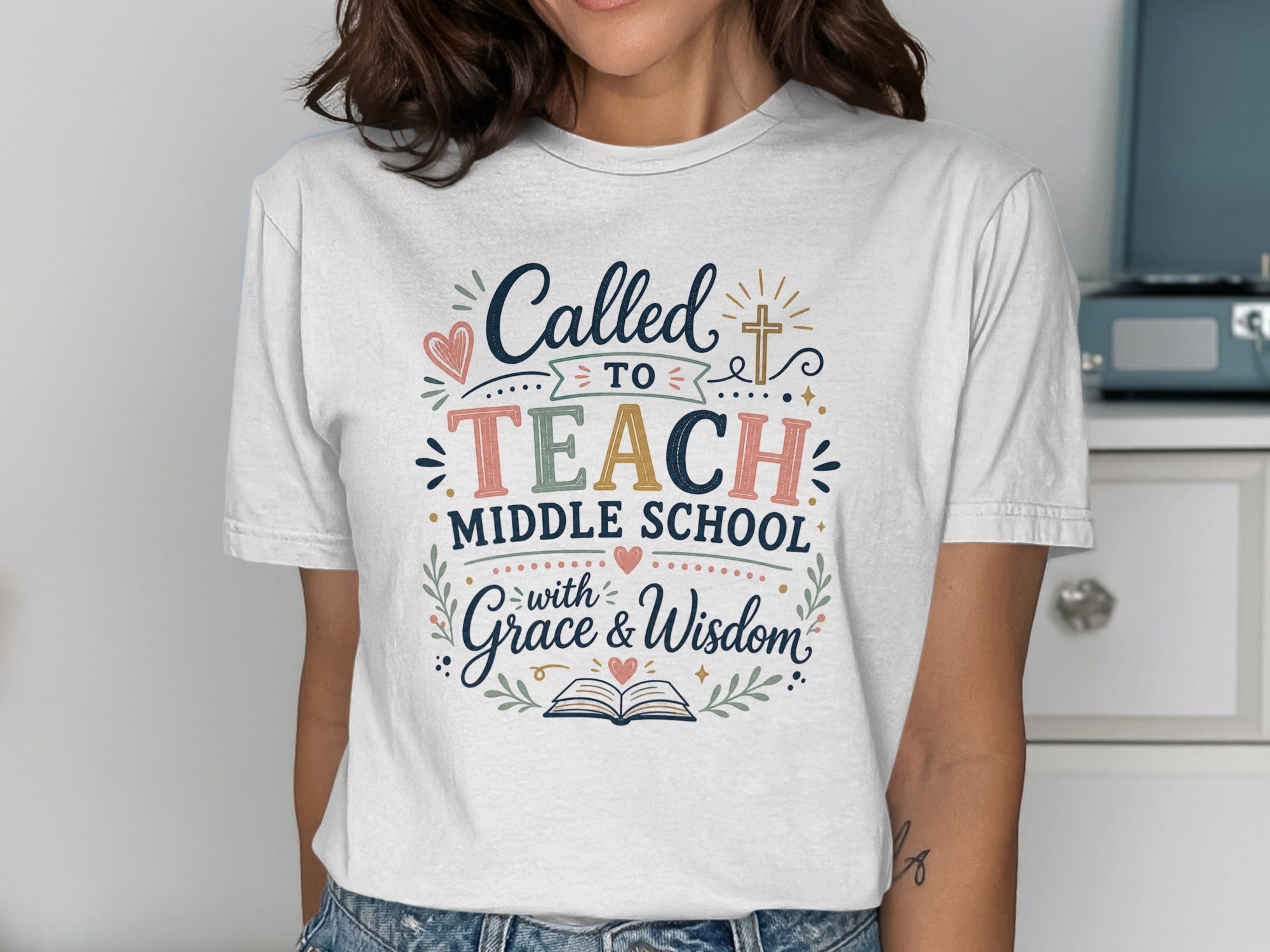 White t-shirt with "Called to Teach Middle School with Grace & Wisdom" design.