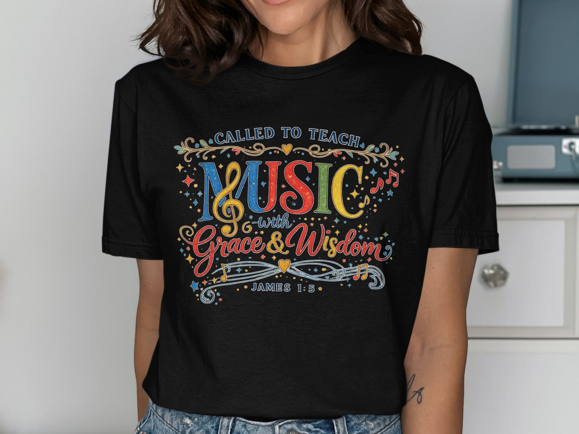 Black t-shirt with "CALLED TO TEACH MUSIC with Grace & Wisdom" and "JAMES 1:5".