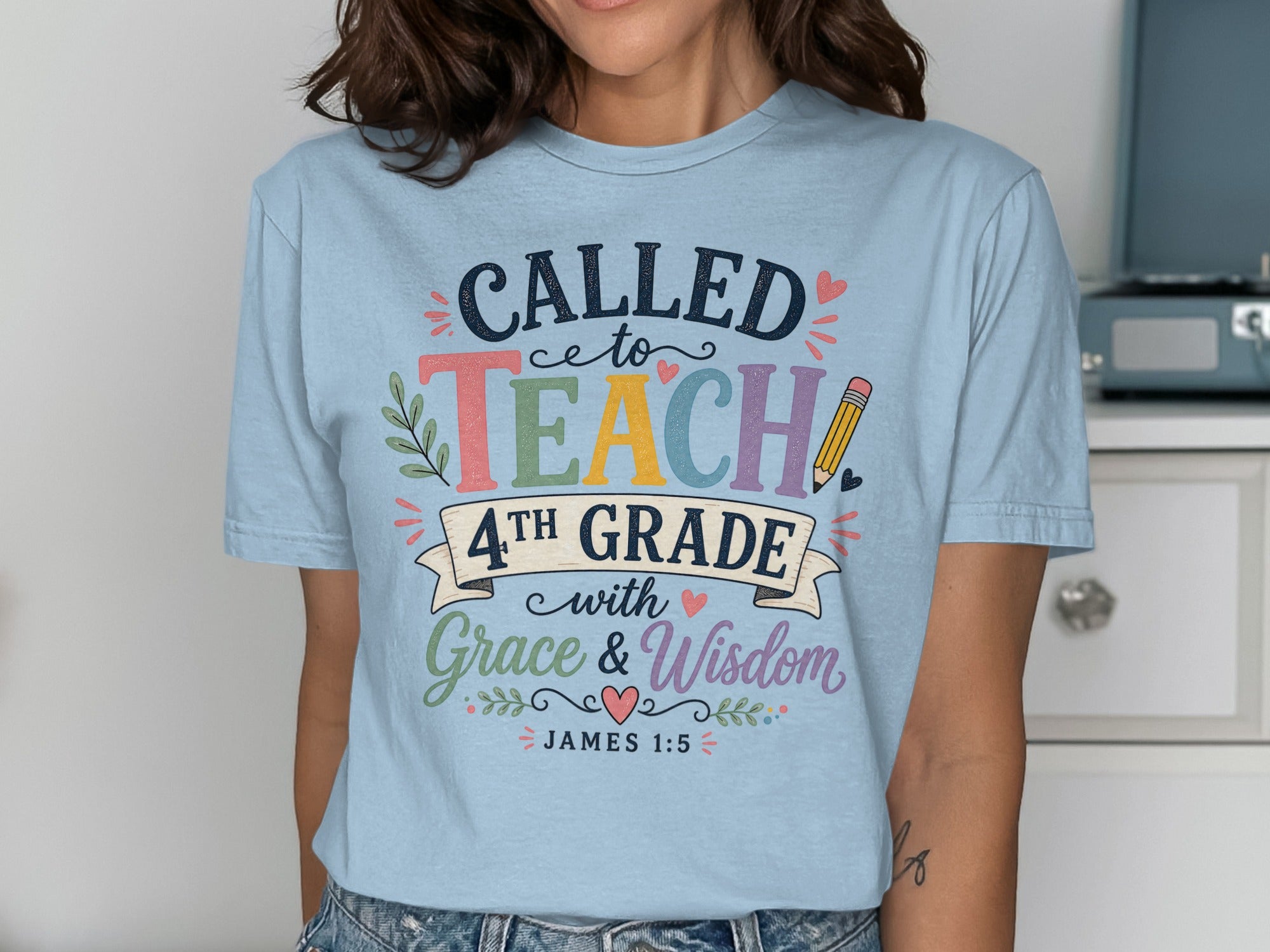 Light blue t-shirt with "Called to Teach 4th Grade with Grace & Wisdom" text.