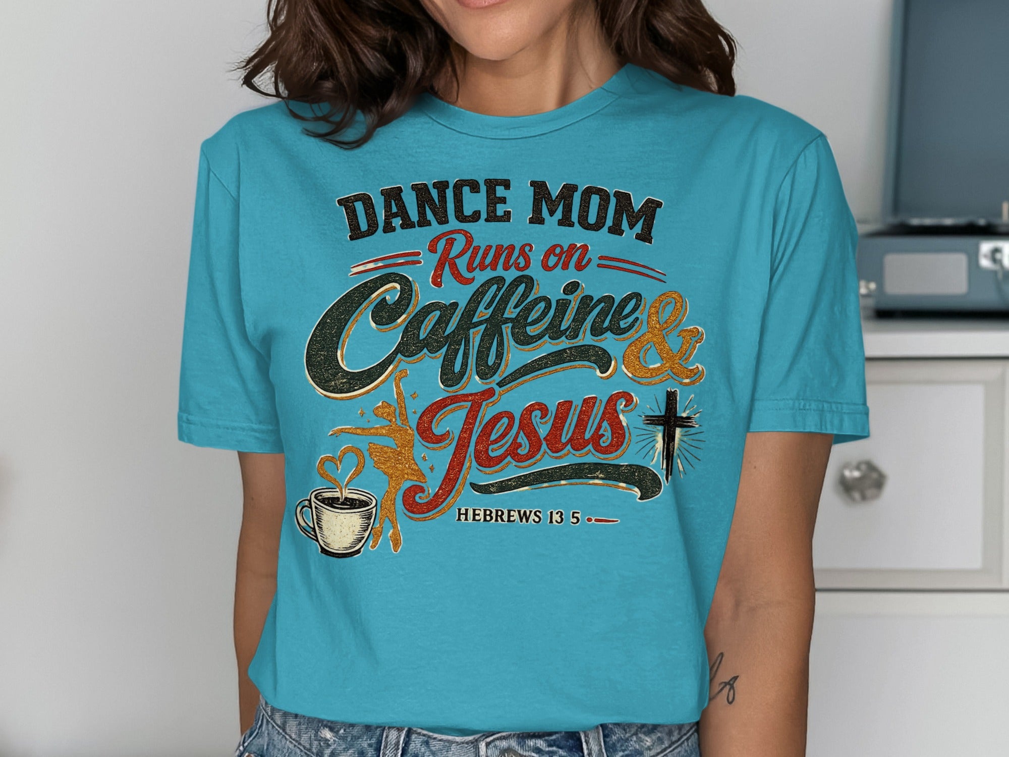 Turquoise t-shirt with "Dance Mom Runs on Caffeine & Jesus" text and graphics.
