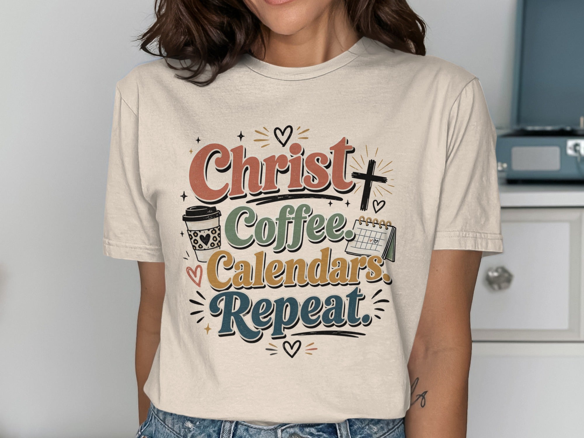 Christ Coffee Calendars Repeat graphic on a t-shirt.