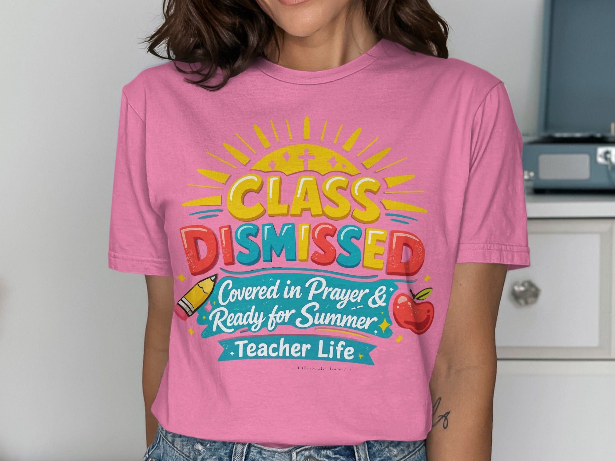 Pink t-shirt with "Class Dismissed" and sun graphic for summer.
