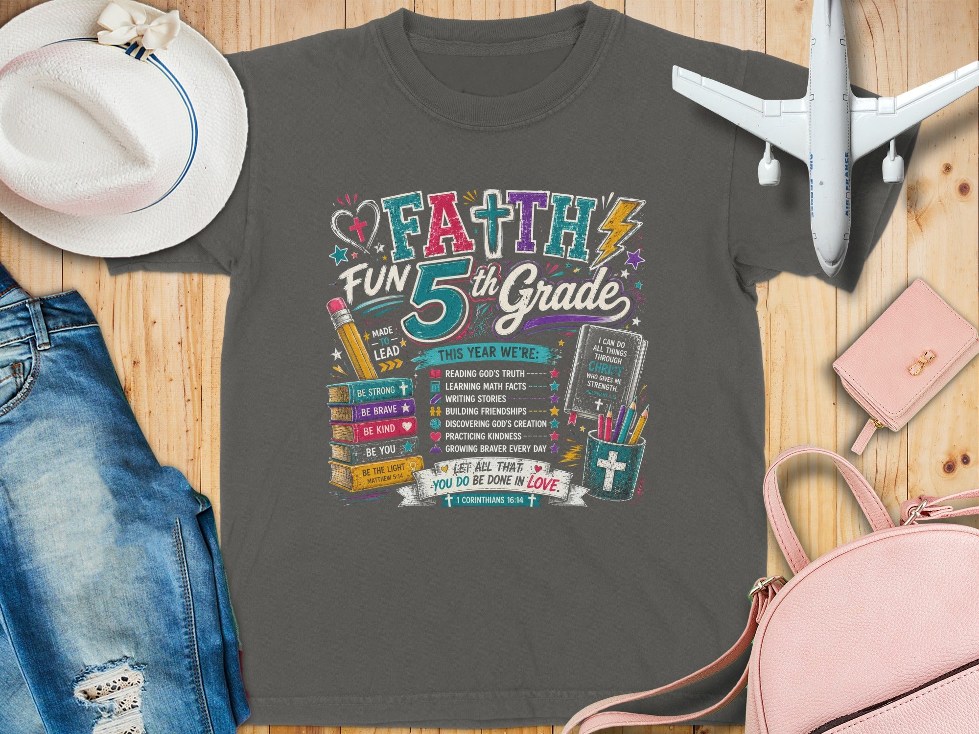 Faith 5th Grade graphic tee with Bible verses and inspirational quotes.