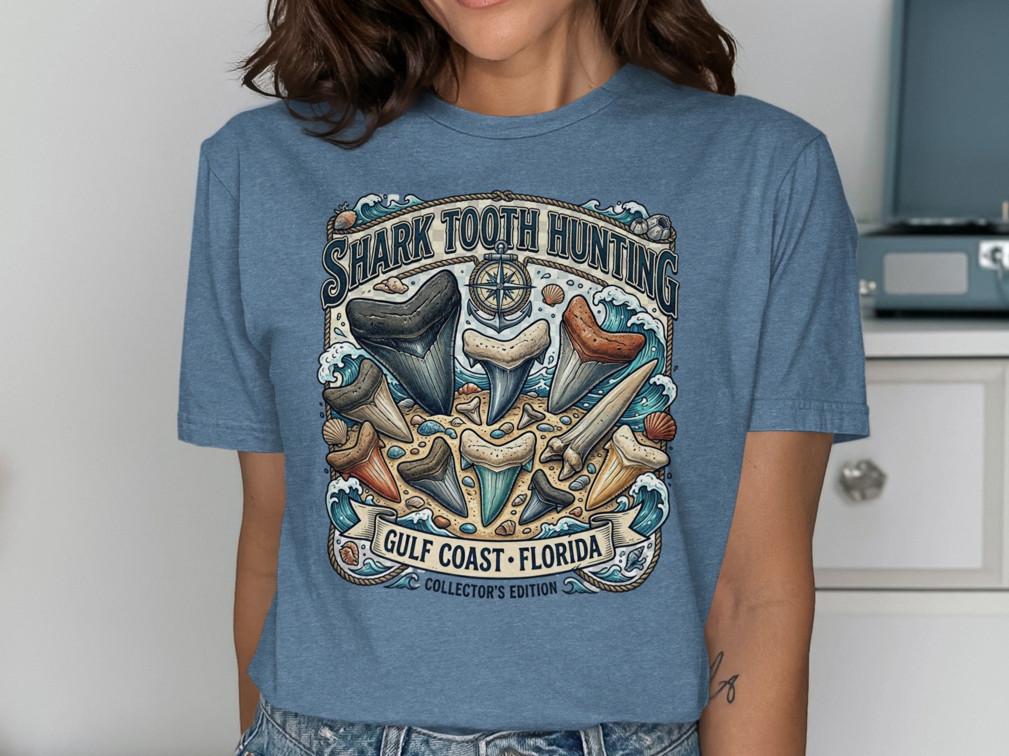 Blue t-shirt with "Shark Tooth Hunting Gulf Coast Florida Collector's Edition" graphic.