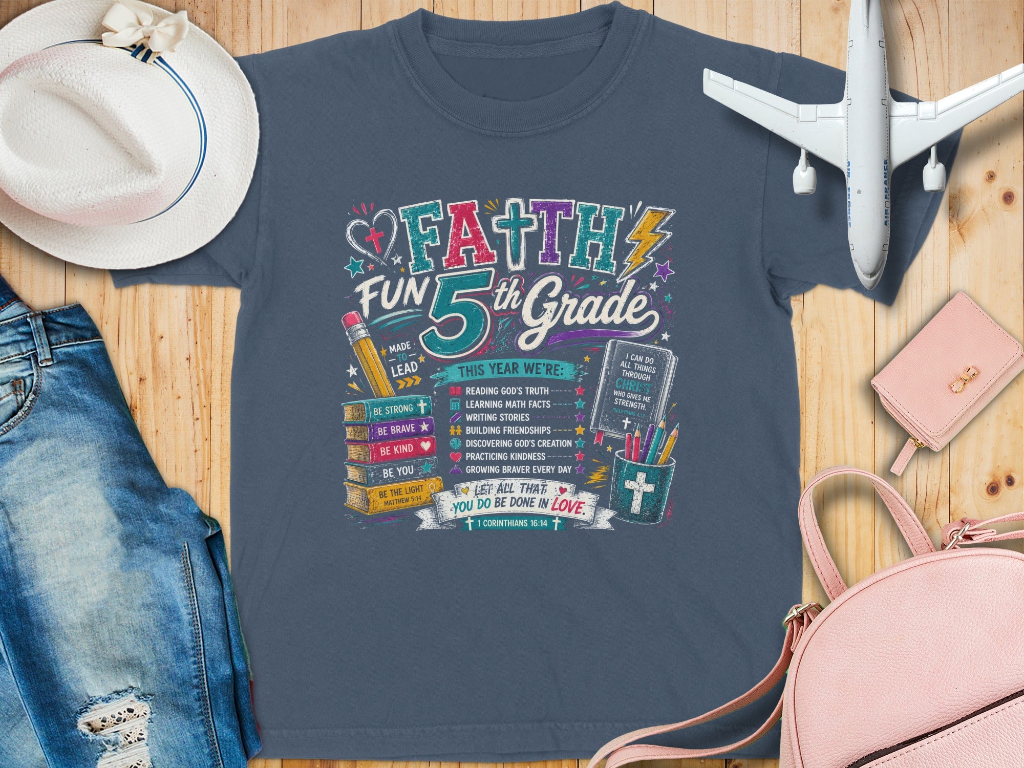 Faith 5th Grade graphic tee with Bible verses and inspirational messages.