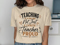 Cream t-shirt with text "Teaching is not just a career, teacher proud".