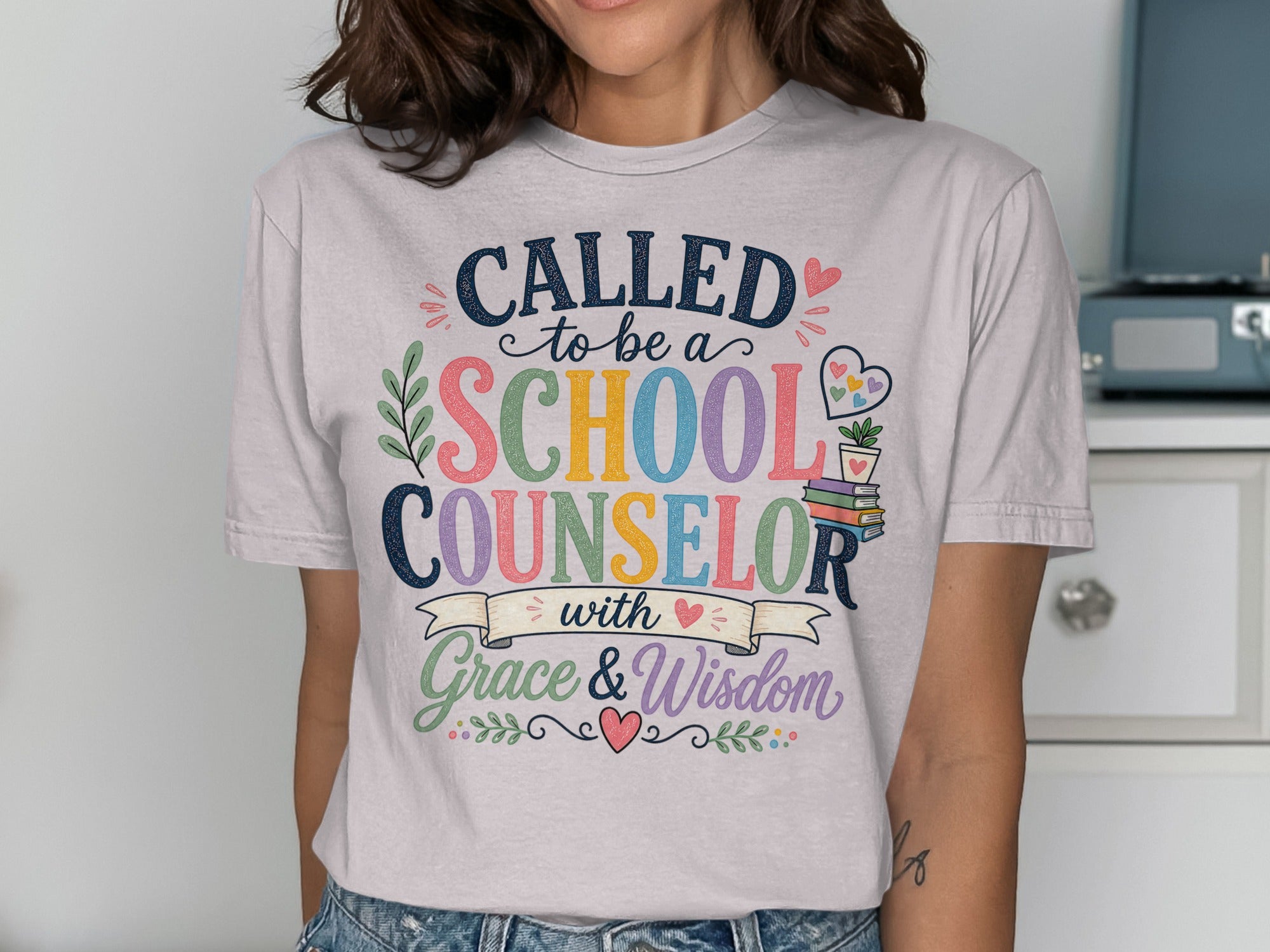 "Called to be a School Counselor with Grace & Wisdom" text on a t-shirt.
