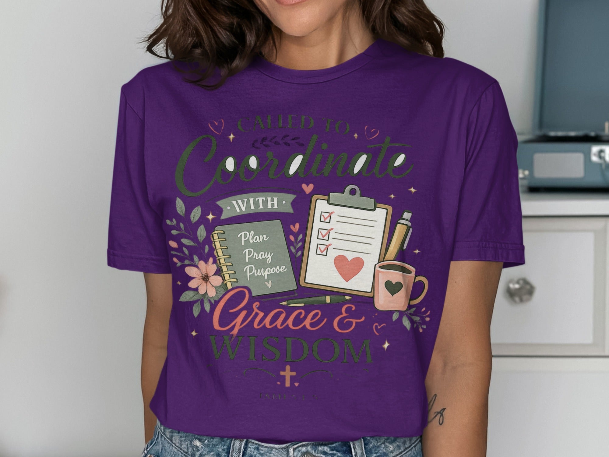 Purple t-shirt with "Called to Coordinate with Grace & Wisdom" text and planner design.