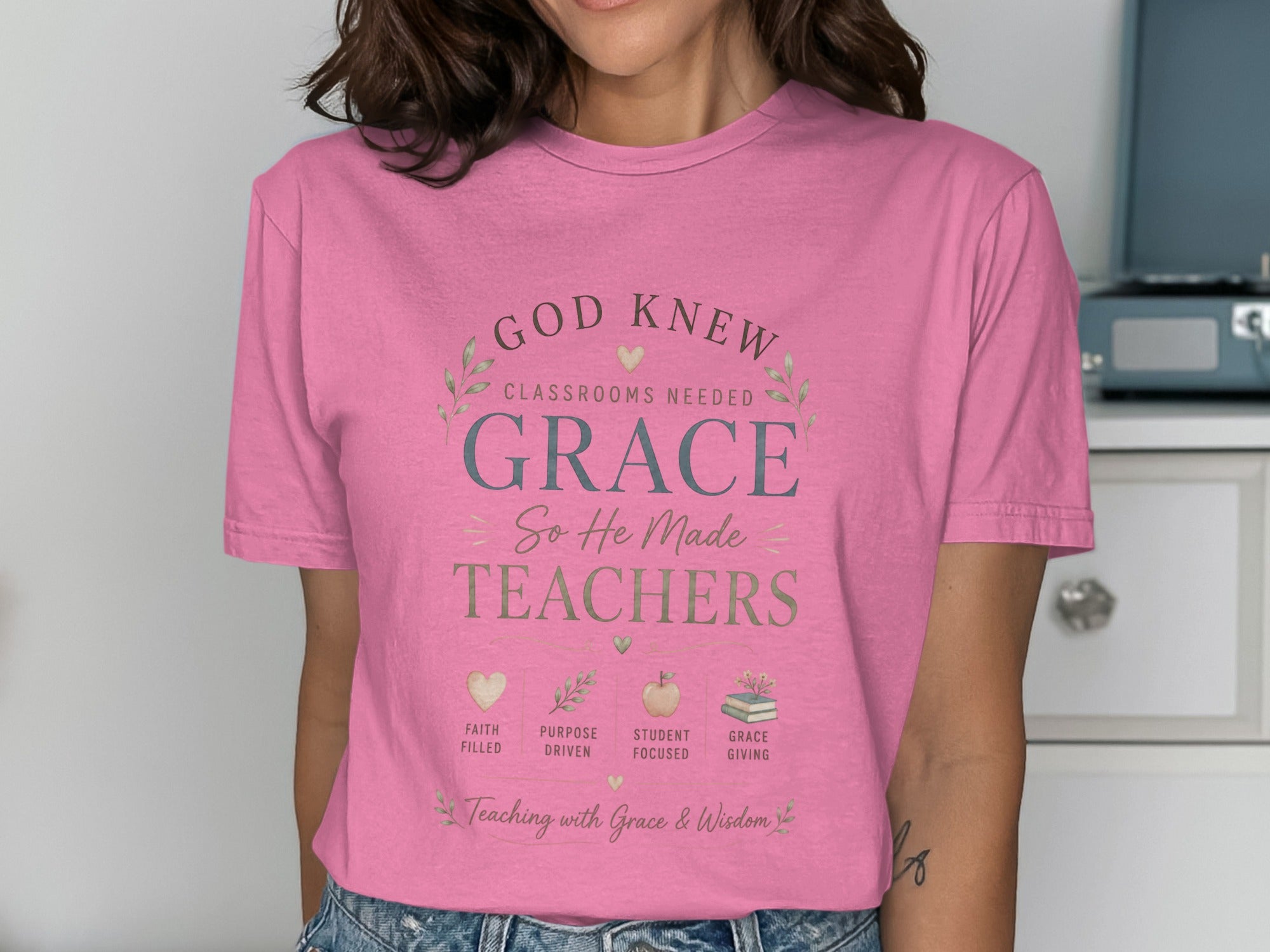 Pink t-shirt with "God Knew Classrooms Needed Grace So He Made Teachers" text.