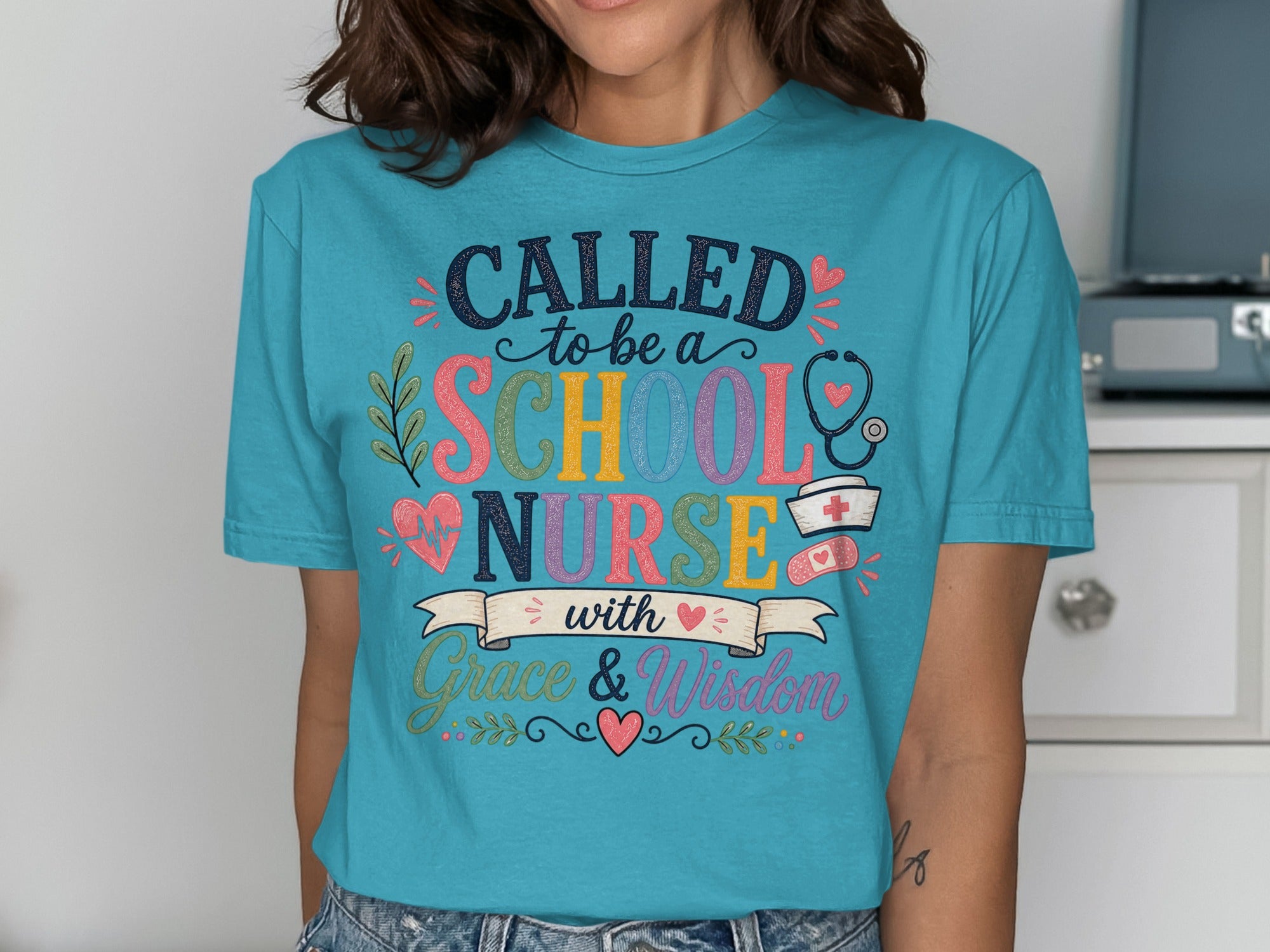 Turquoise t-shirt with "Called to be a School Nurse with Grace & Wisdom" text.