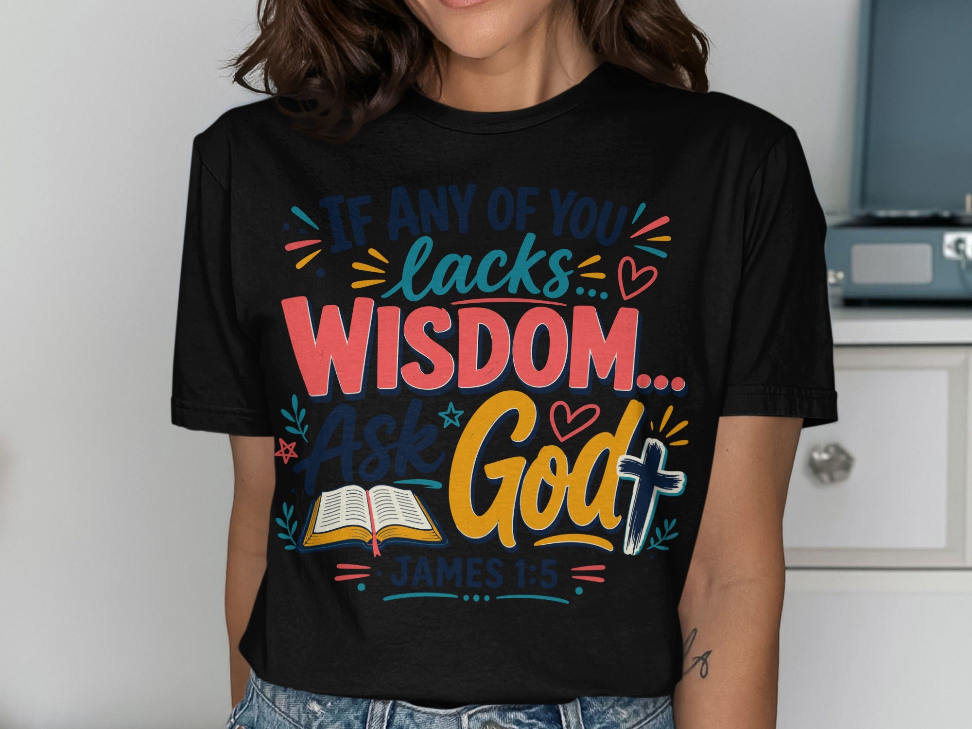 Black t-shirt with text "If any of you lacks wisdom... ask God." James 1:5.