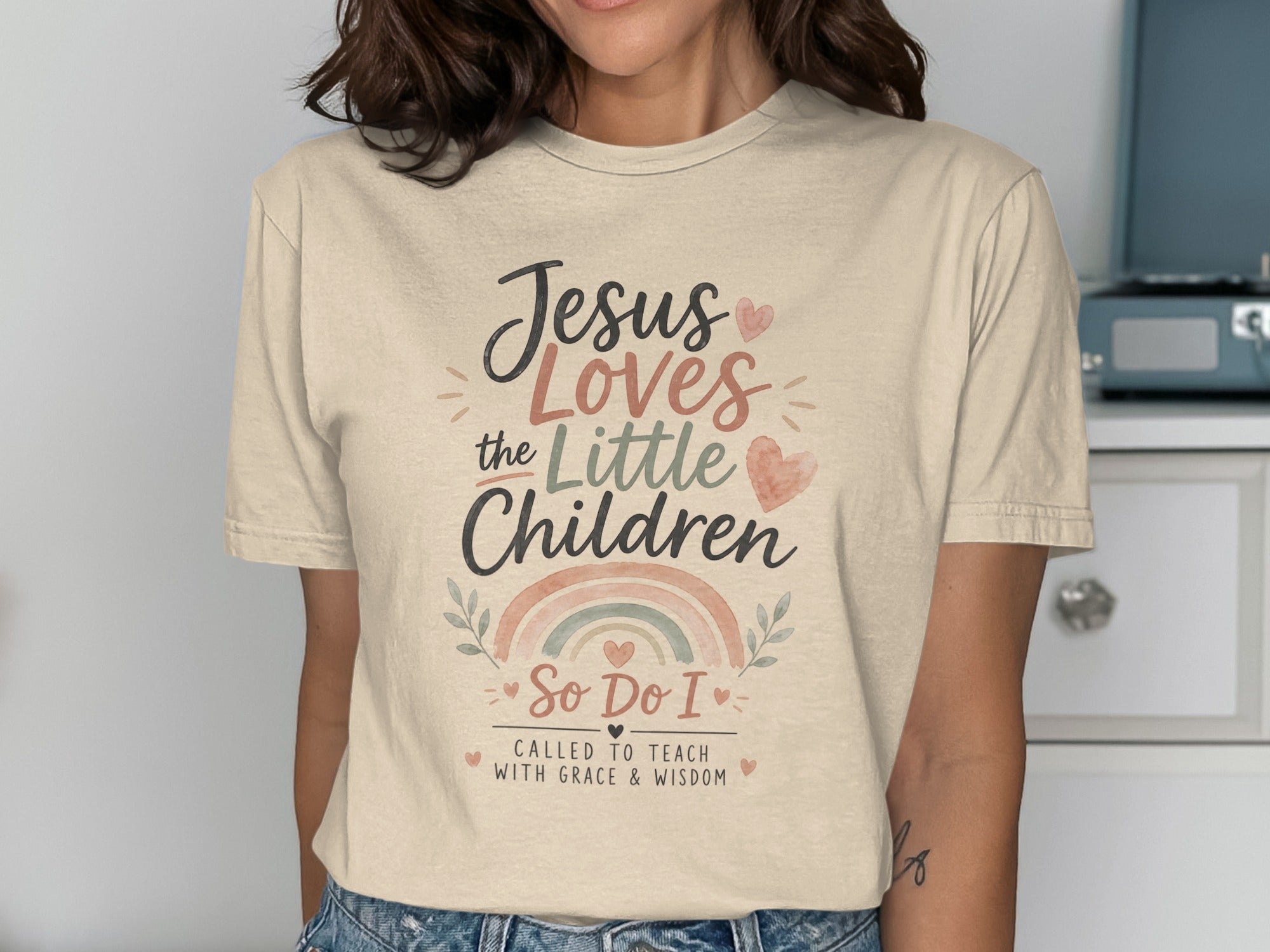 T-shirt with "Jesus Loves the Little Children So Do I Called to Teach" text.