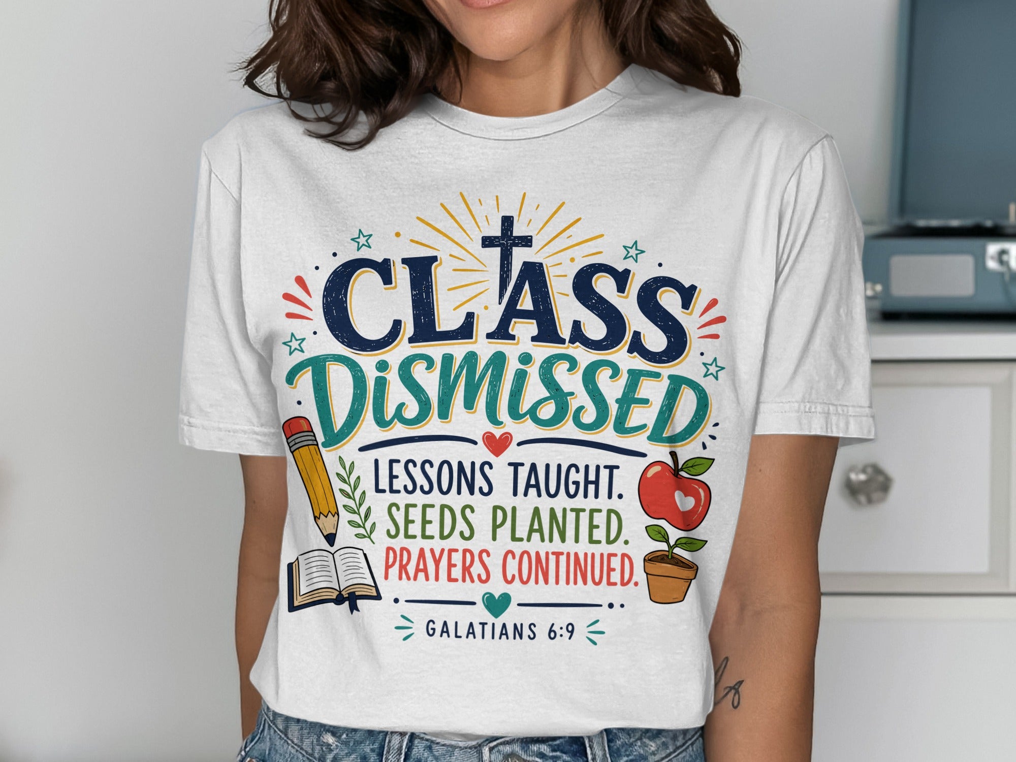 White t-shirt with "Class Dismissed" and biblical quote about planting seeds.