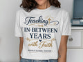 White t-shirt with text "Teaching the in-between years with faith" and "Middle School Teacher".