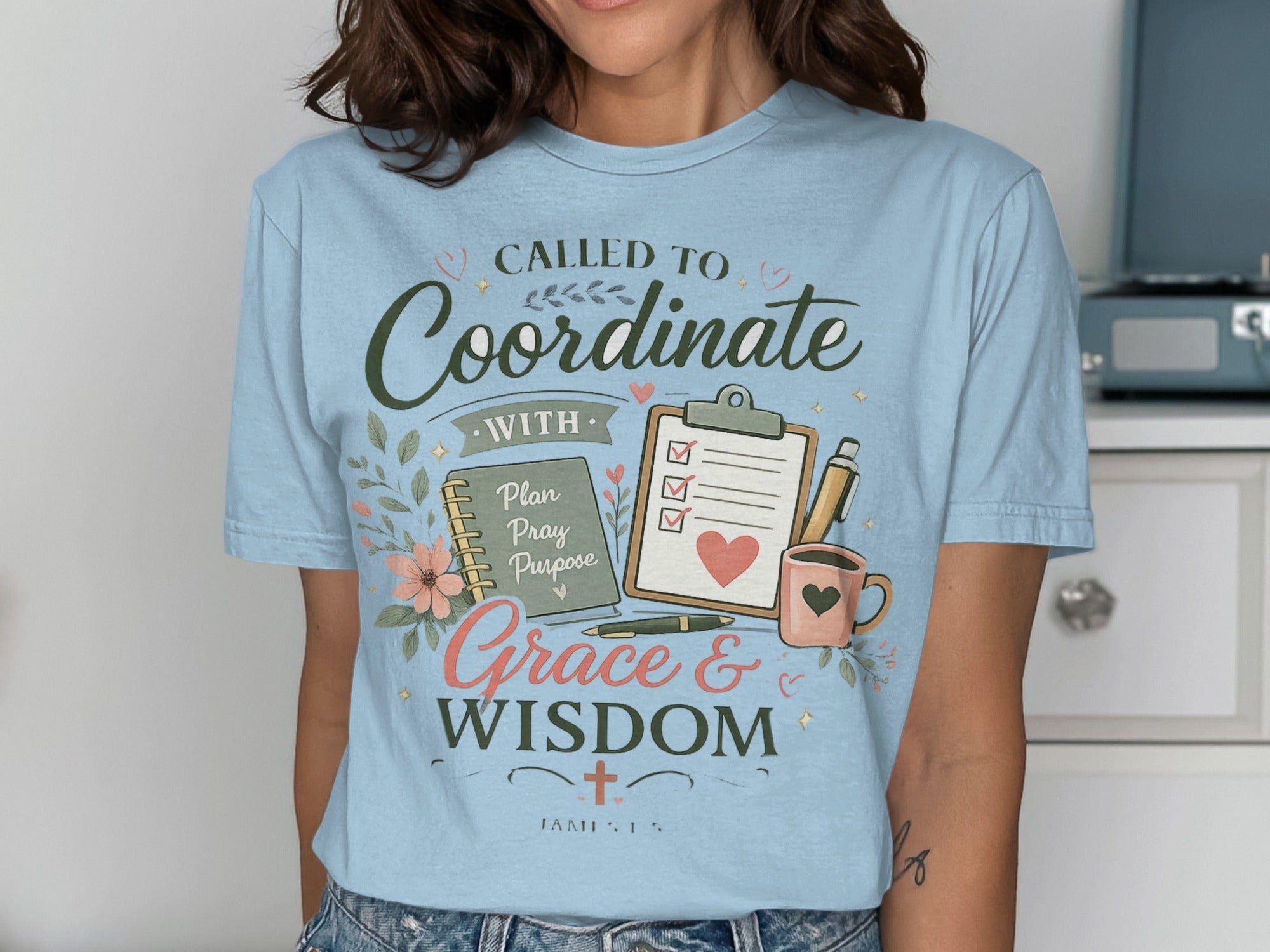 Light blue t-shirt with "Called to Coordinate with Grace & Purpose" text.