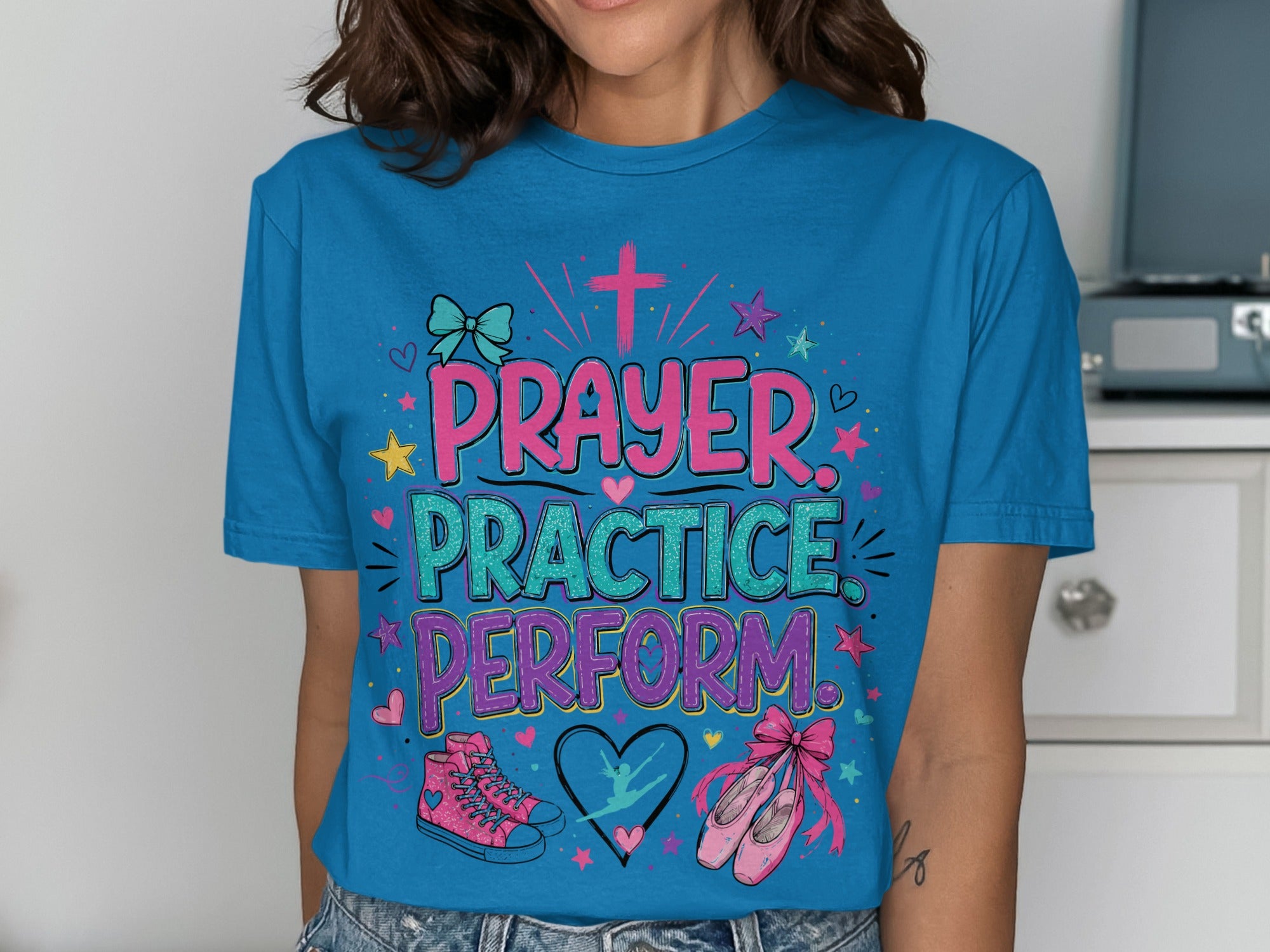 Blue t-shirt with "Prayer Practice Perform" text and dancer graphics.