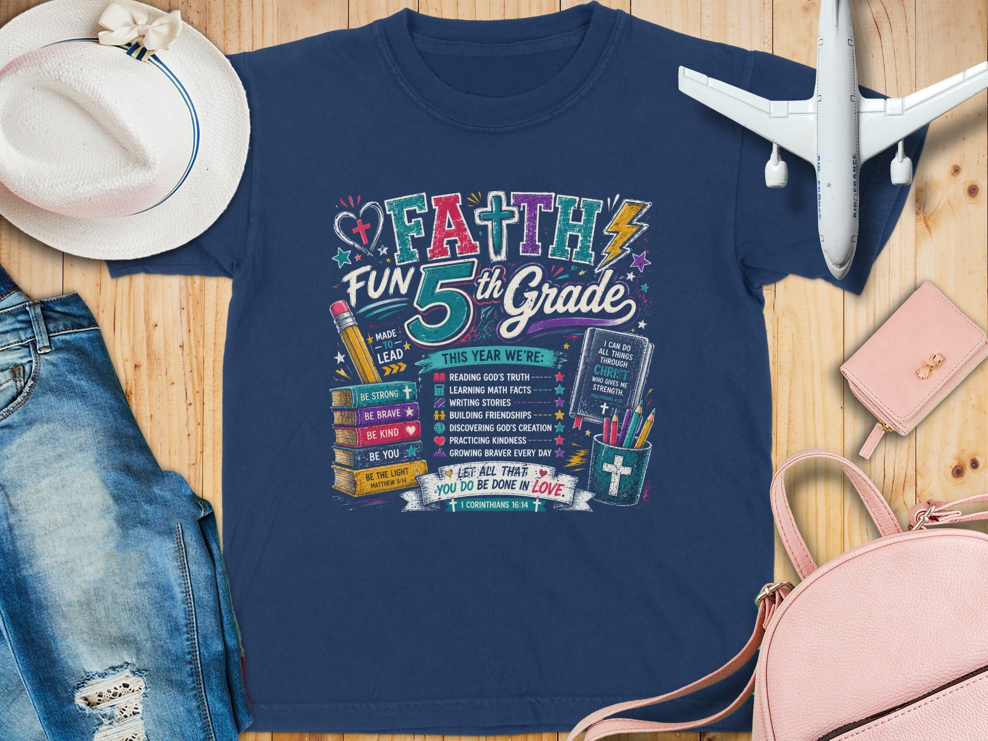 Navy t-shirt with "Faith 5th Grade" graphic and Bible verses.