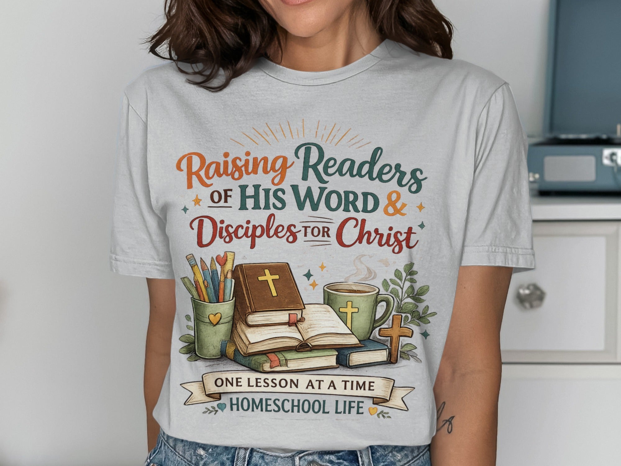 T-shirt with "Raising Readers of His Word & Disciples for Christ" and homeschooling imagery.