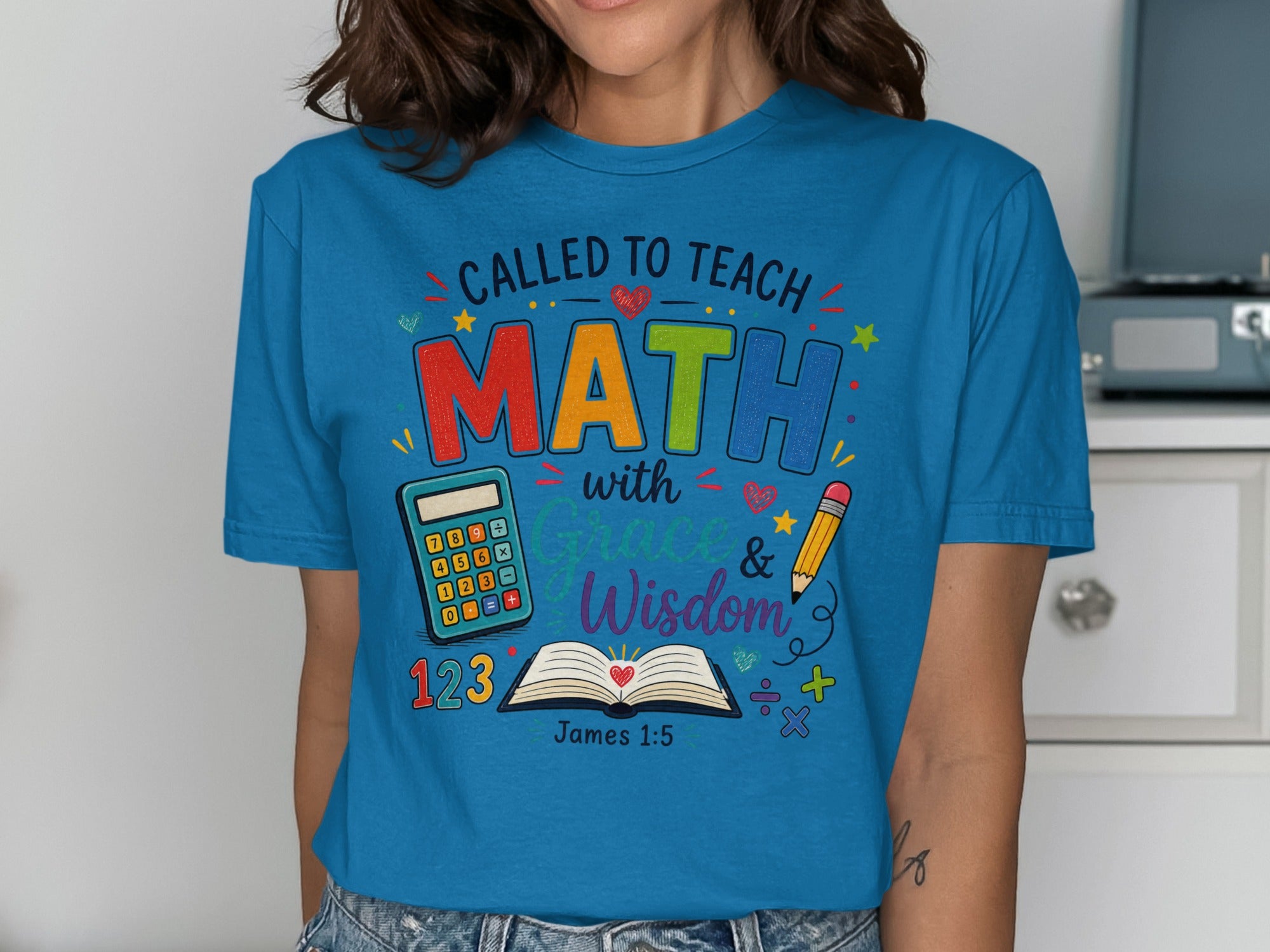 Blue t-shirt with "Called to Teach Math with Grace & Wisdom" and Bible verse James 1:5.